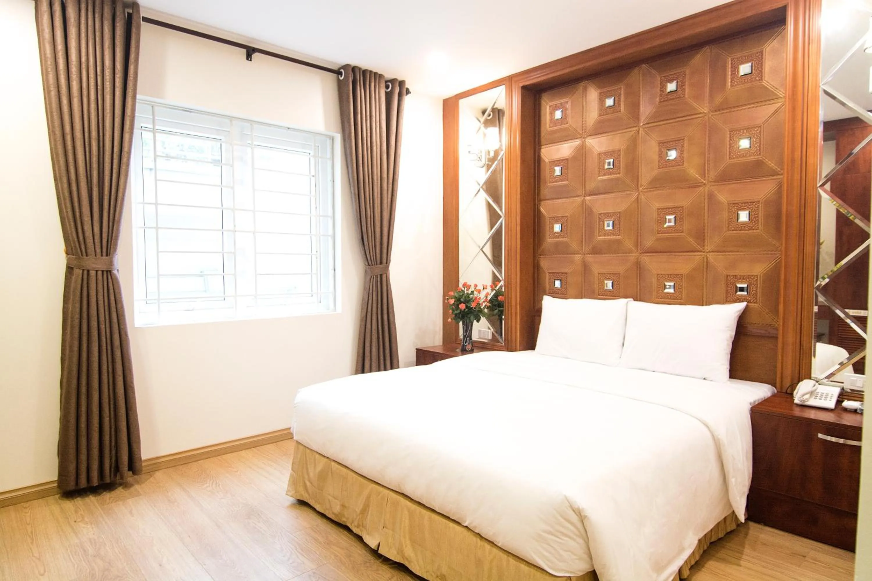 Bed in Canary Ha Noi Hotel