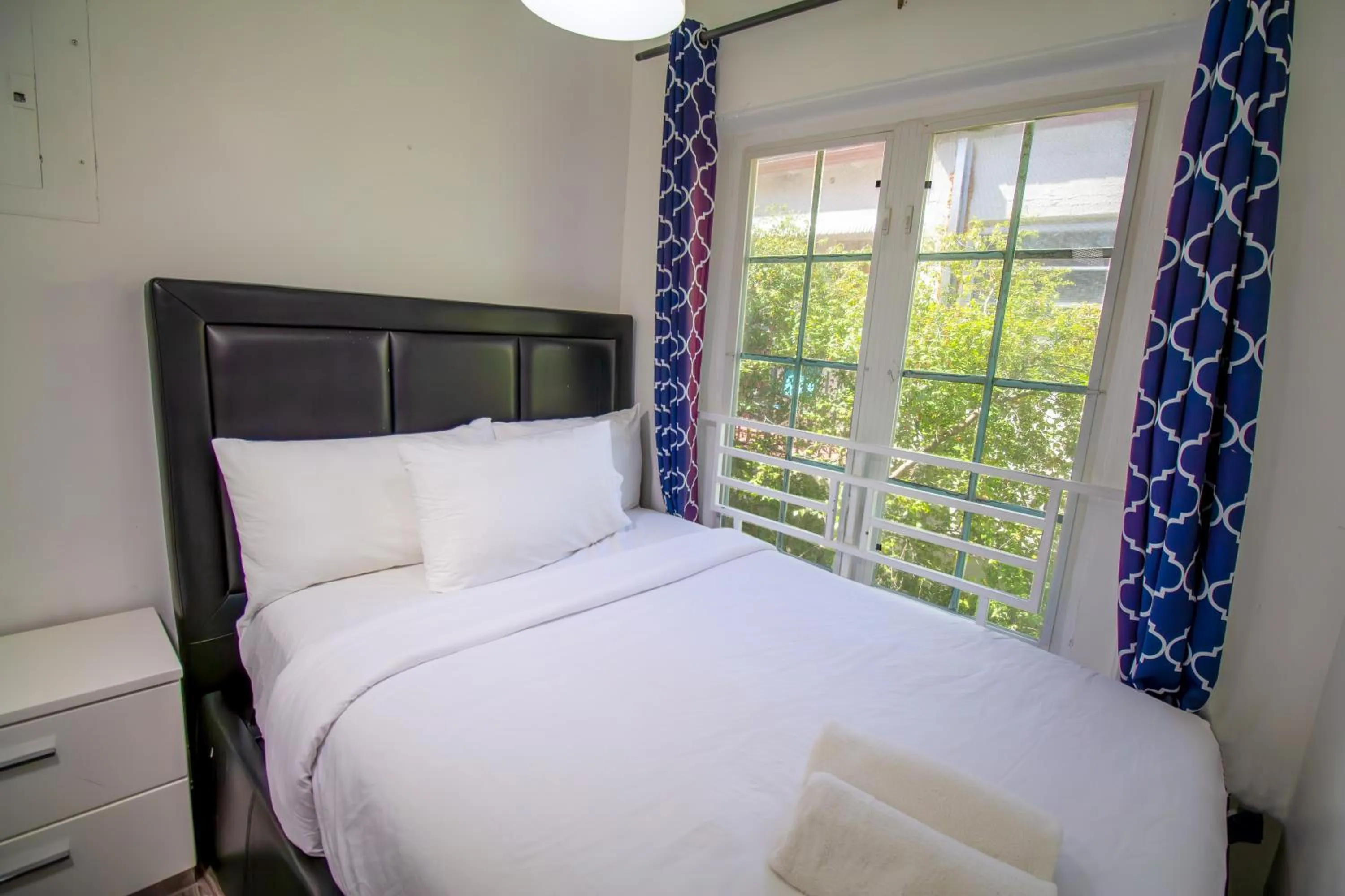 Bed in Courtyard Apartments Part of the Oasis Casita Collection