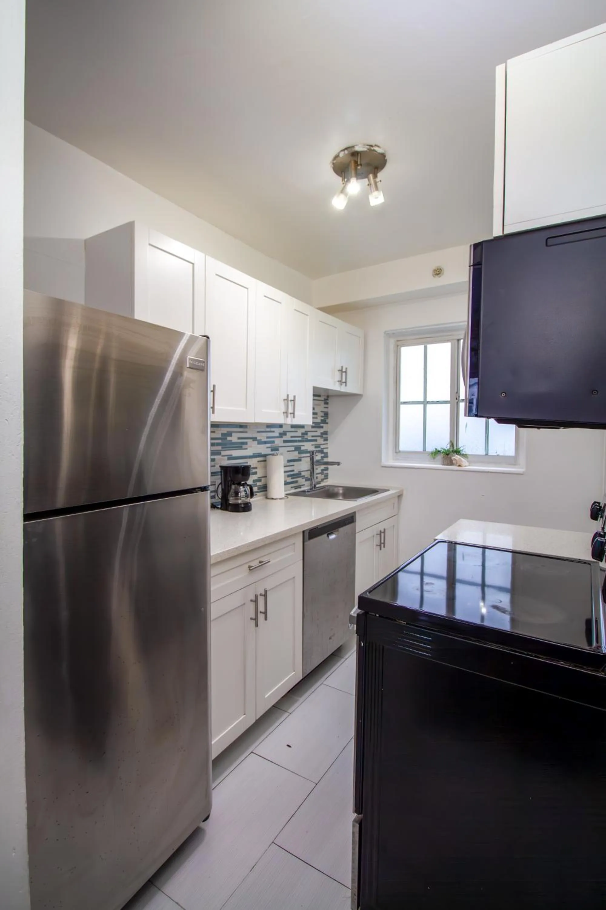 Kitchen or kitchenette in Courtyard Apartments Part of the Oasis Casita Collection