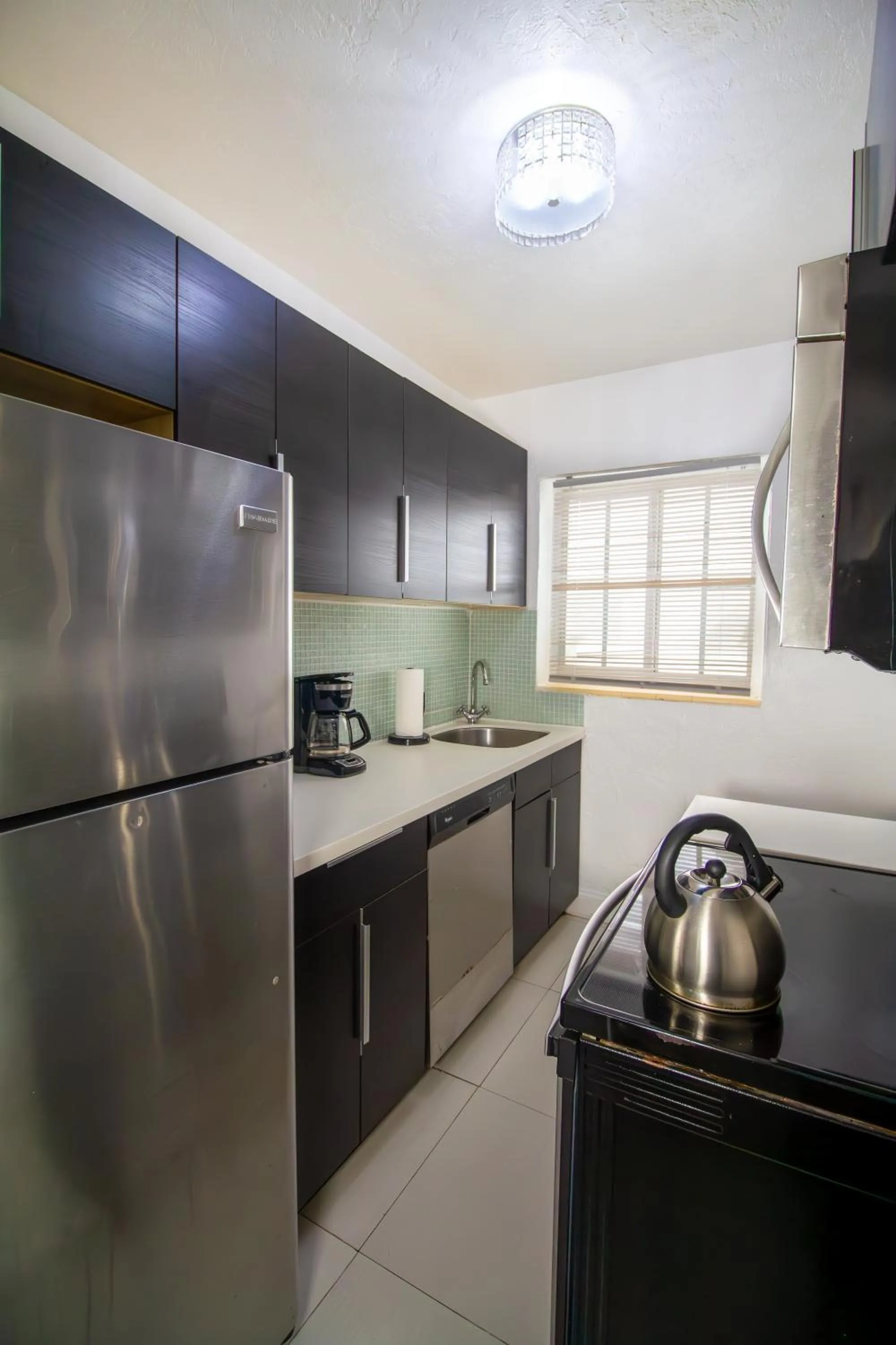 Kitchen or kitchenette in Courtyard Apartments Part of the Oasis Casita Collection