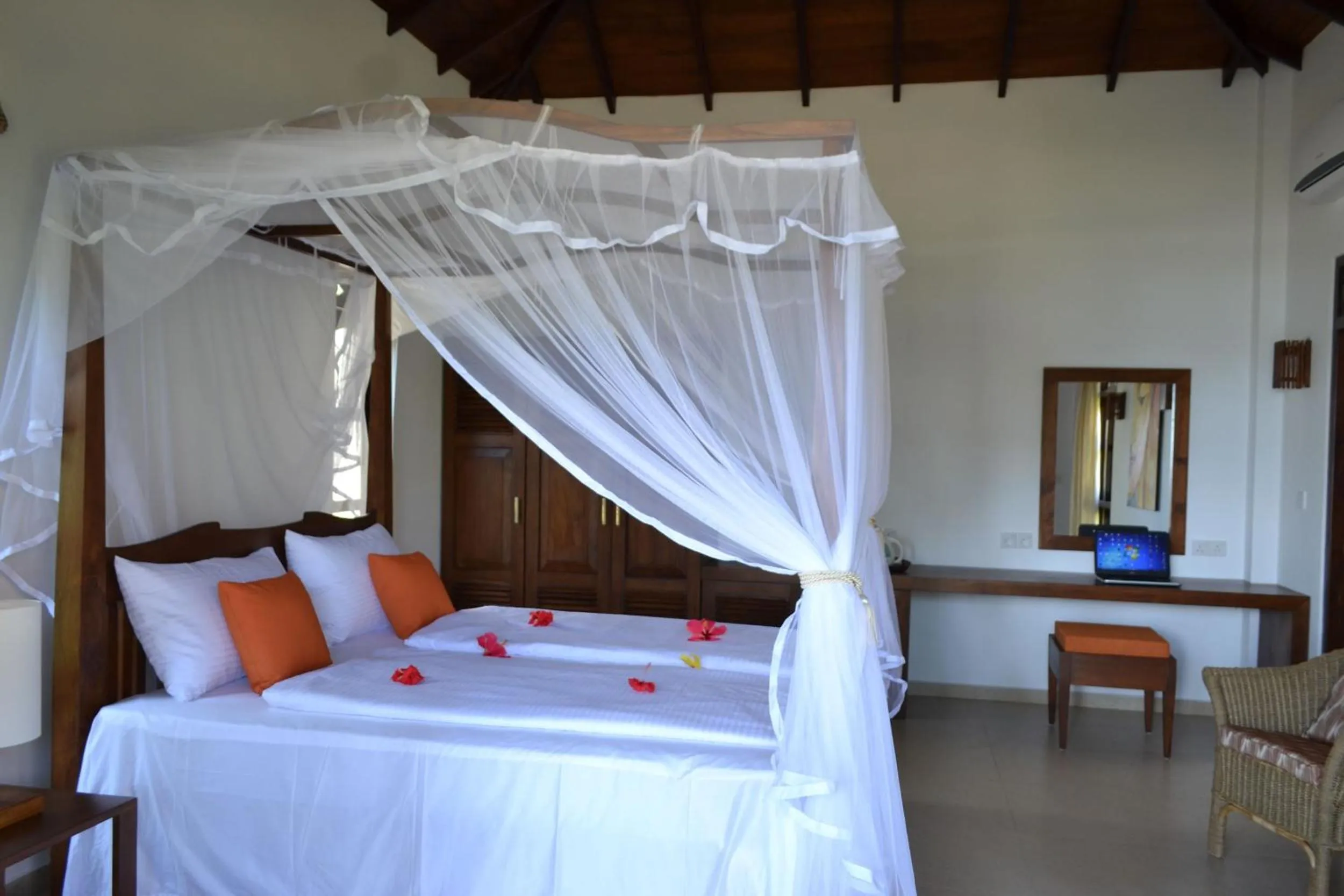 Bed in Lanka Beach Boutique Bungalows & Grand Villa