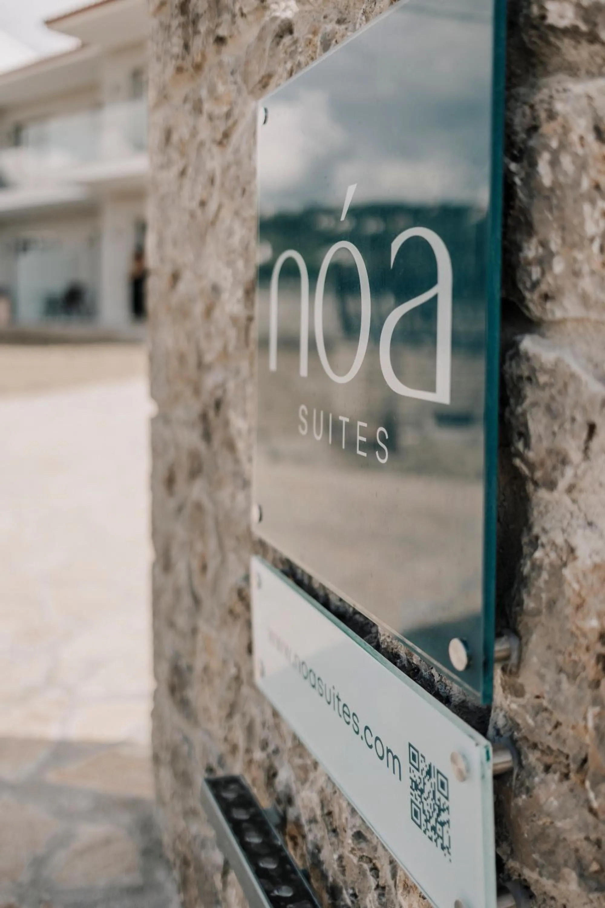 Property logo or sign in Noa Suites