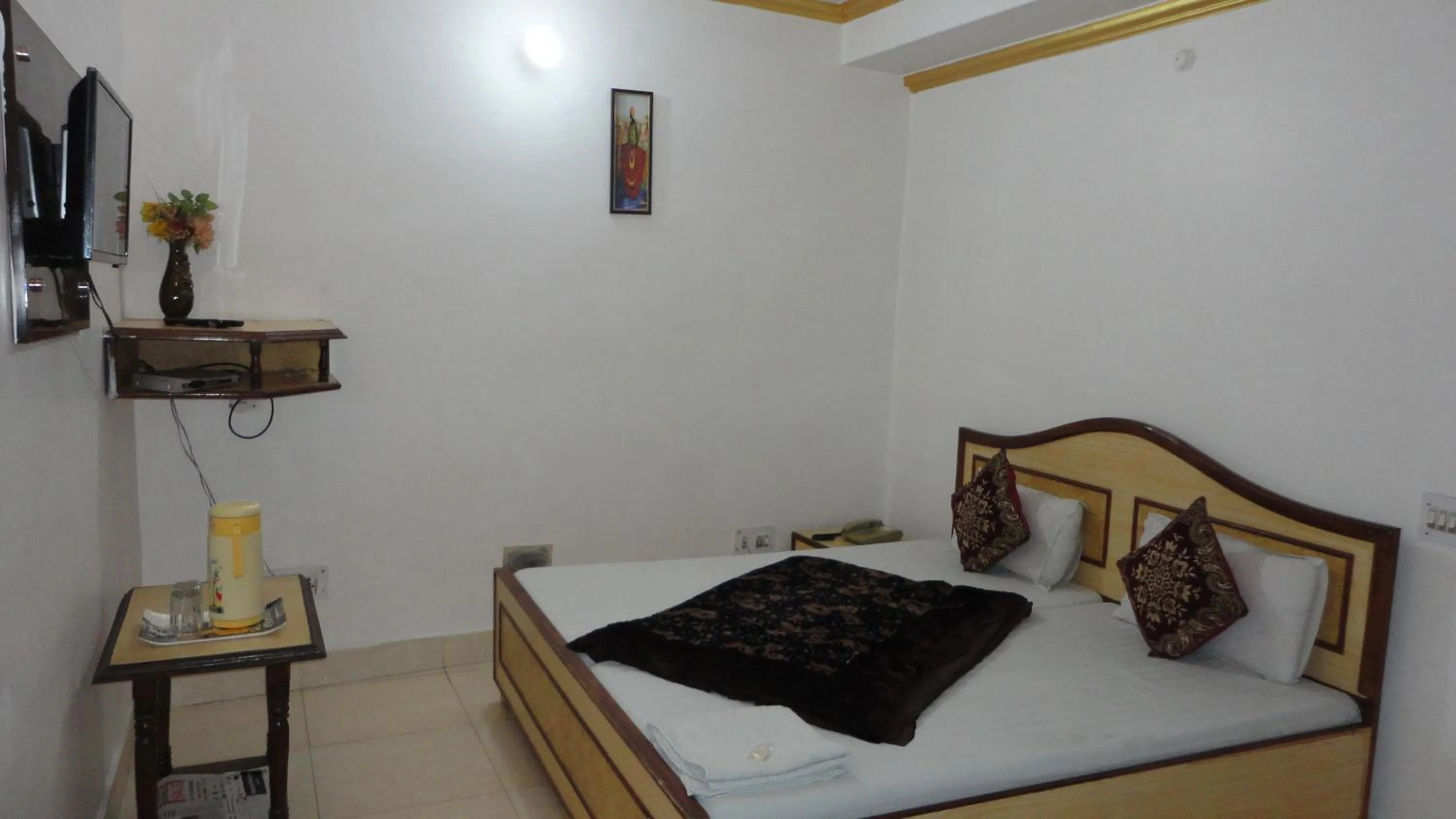 Bed in Hotel Swarajya Palace