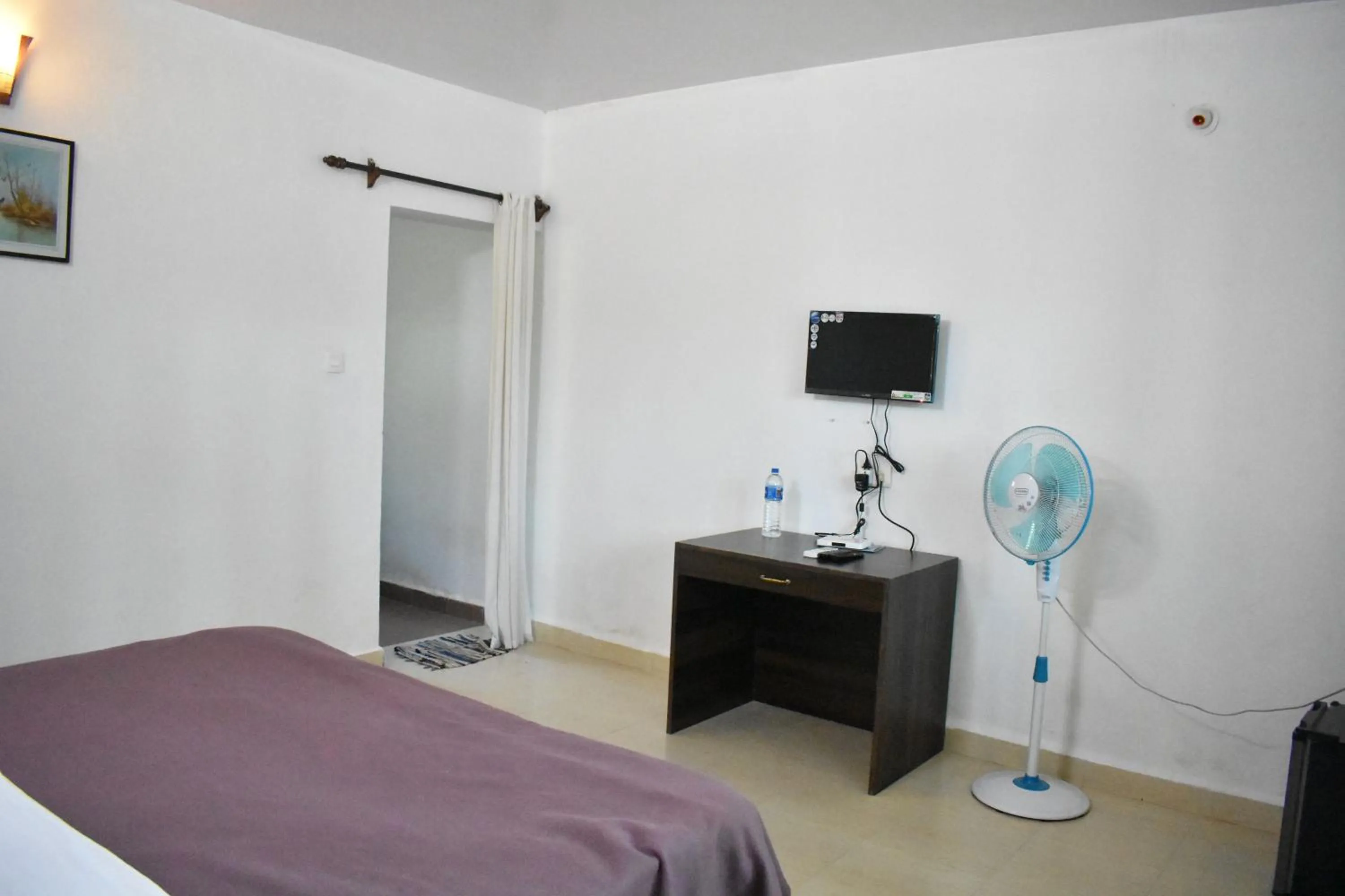 Bed in Club Palolem Resort