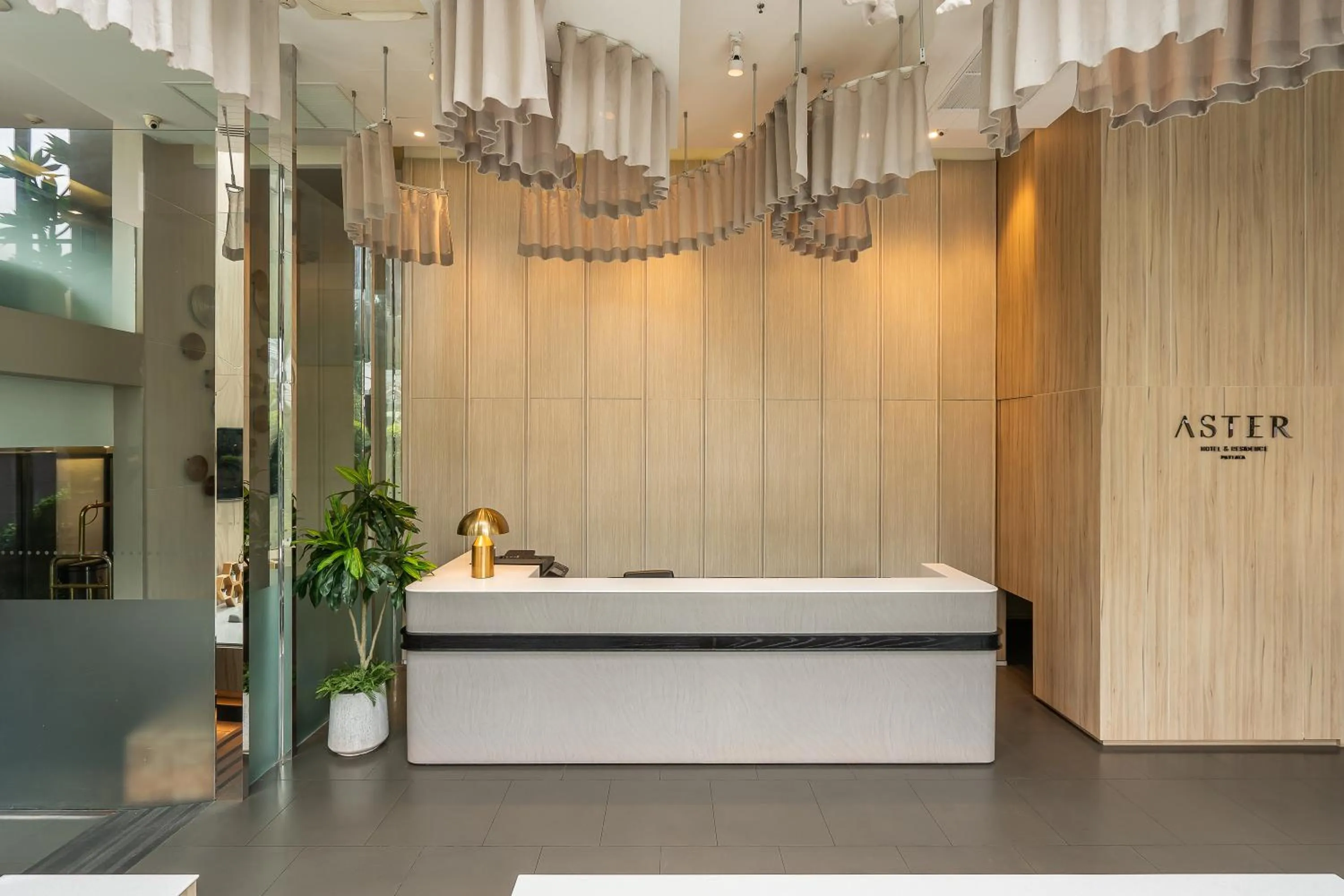 Lobby or reception in Aster Hotel and Residence by At Mind