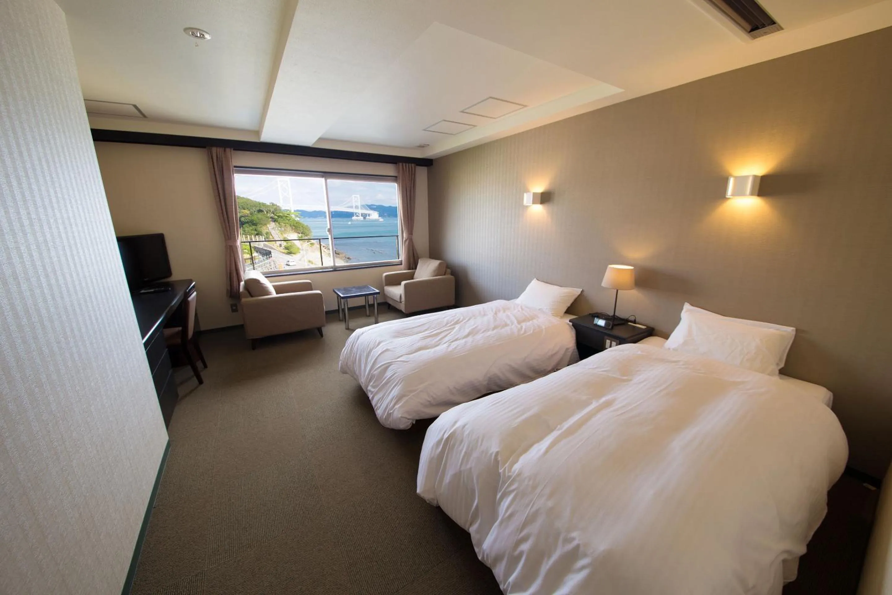 Photo of the whole room, Bed in Seaside Hotel Taimaru Kaigetsu