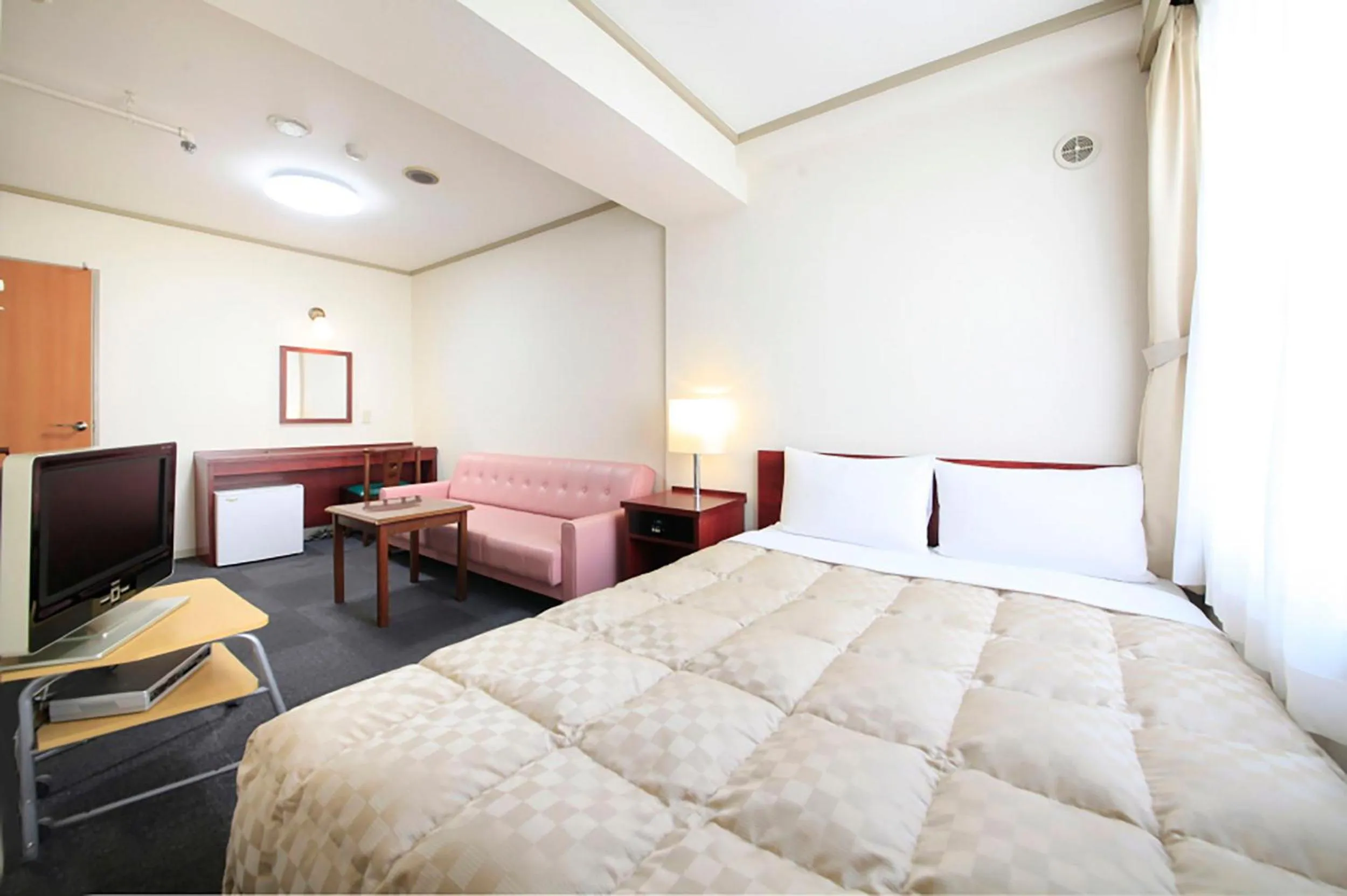 Bed in Shinjuku Urban Hotel