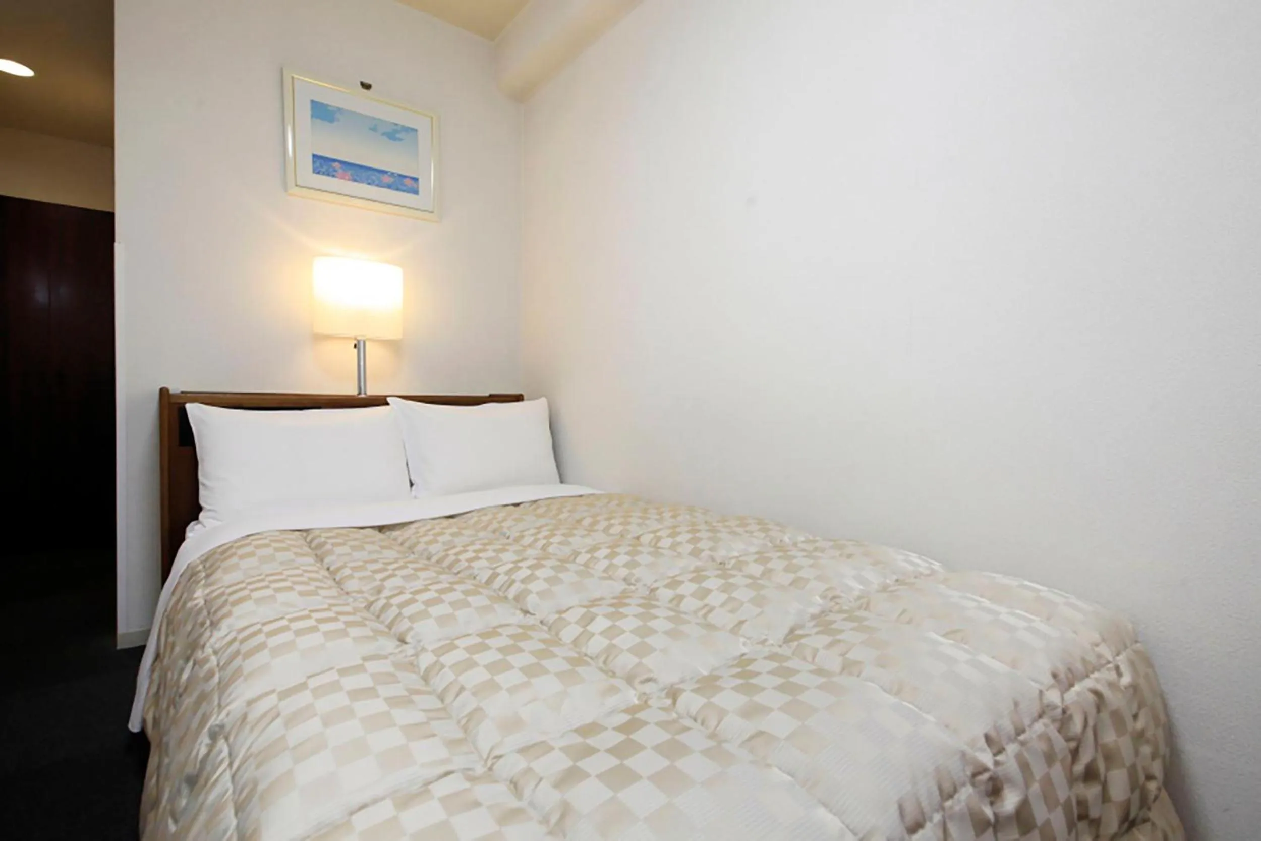 Bed in Shinjuku Urban Hotel