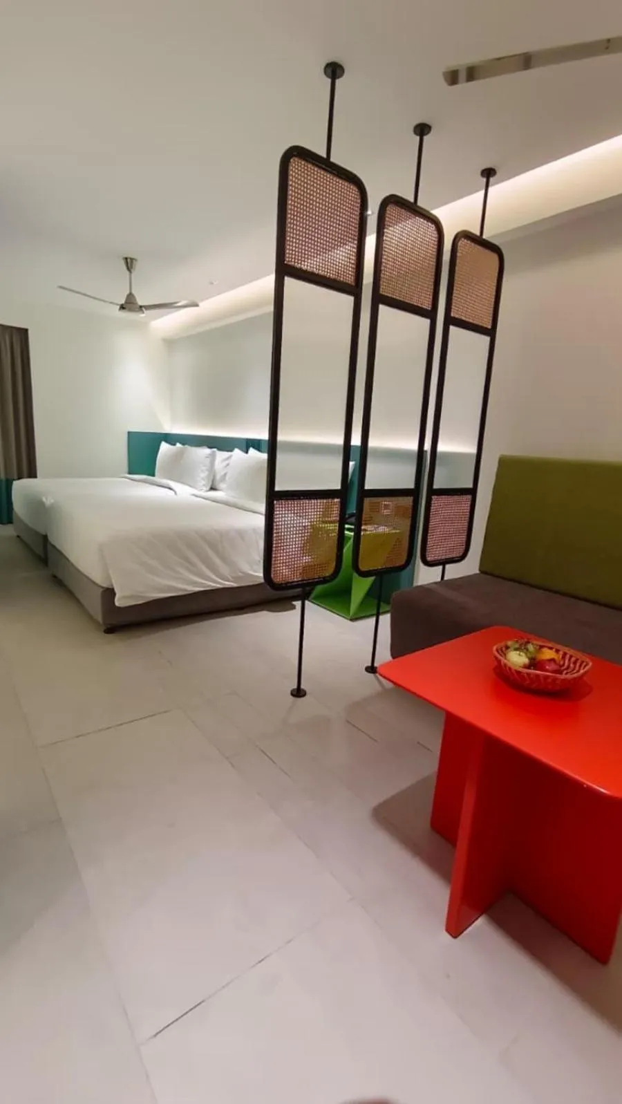 Seating area, Bed in ZIBE Luxe Hyderabad by GRT Hotels