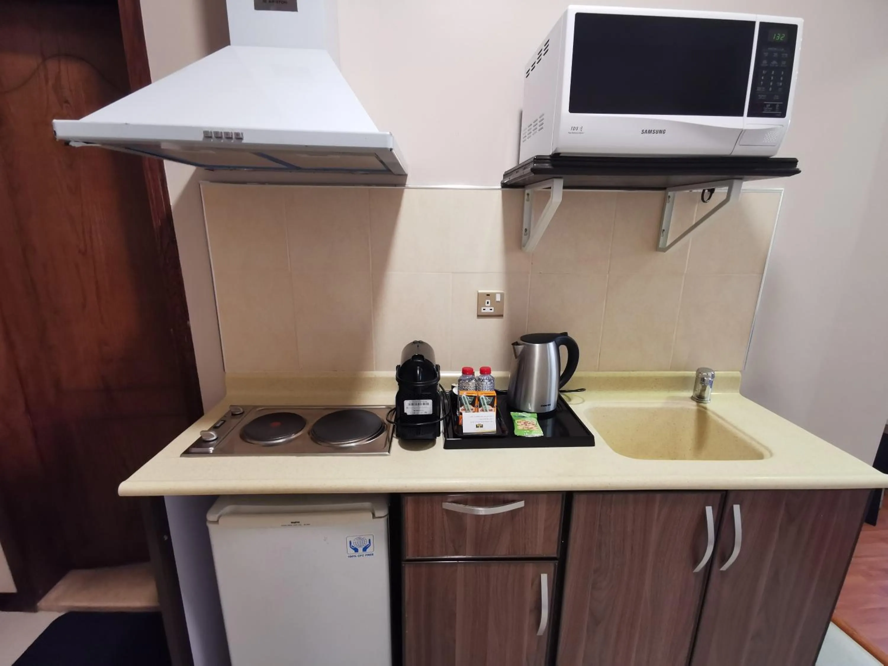 Kitchen or kitchenette in Travellerinn Serviced Apartment
