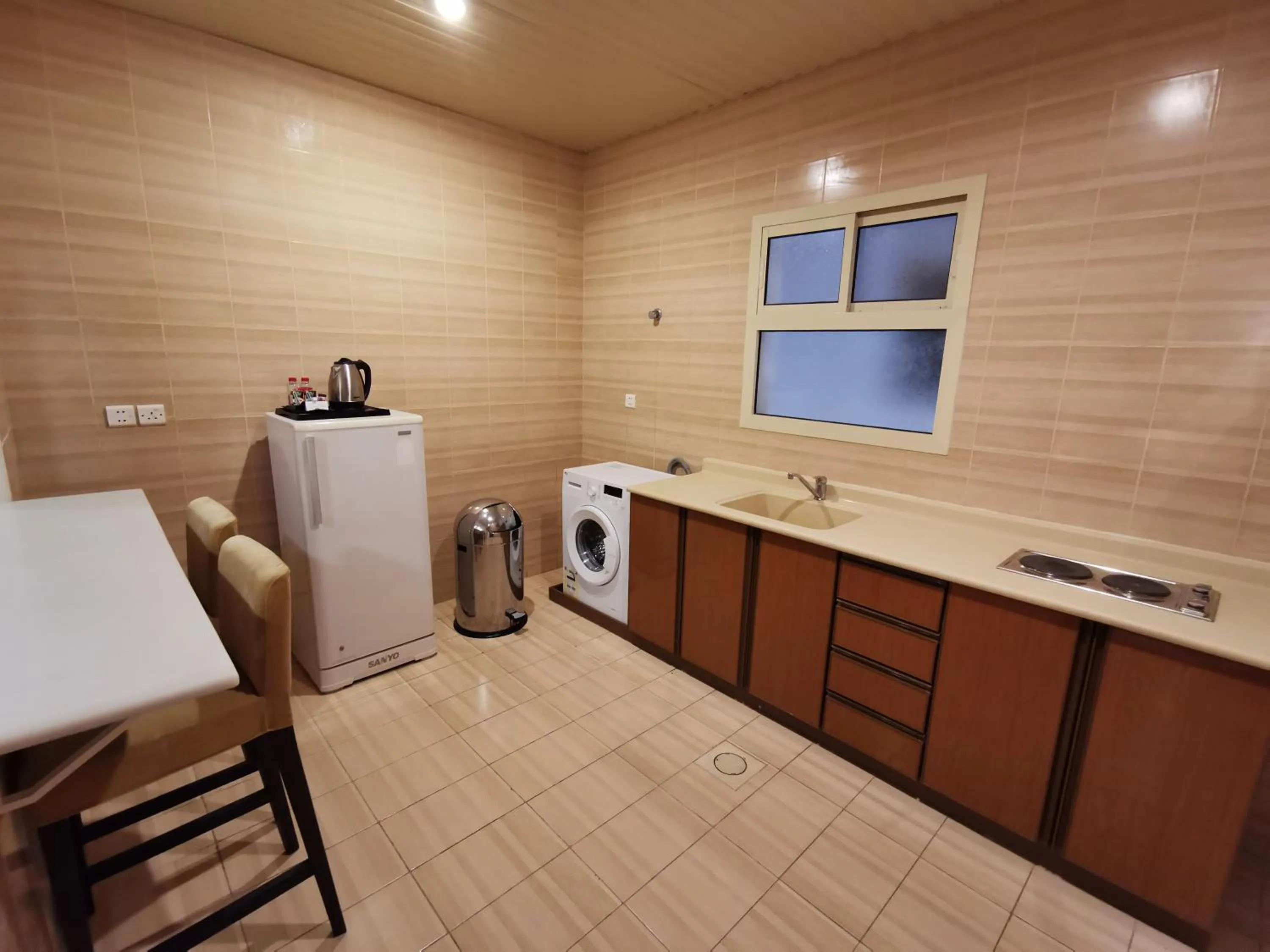 Kitchen or kitchenette in Travellerinn Serviced Apartment