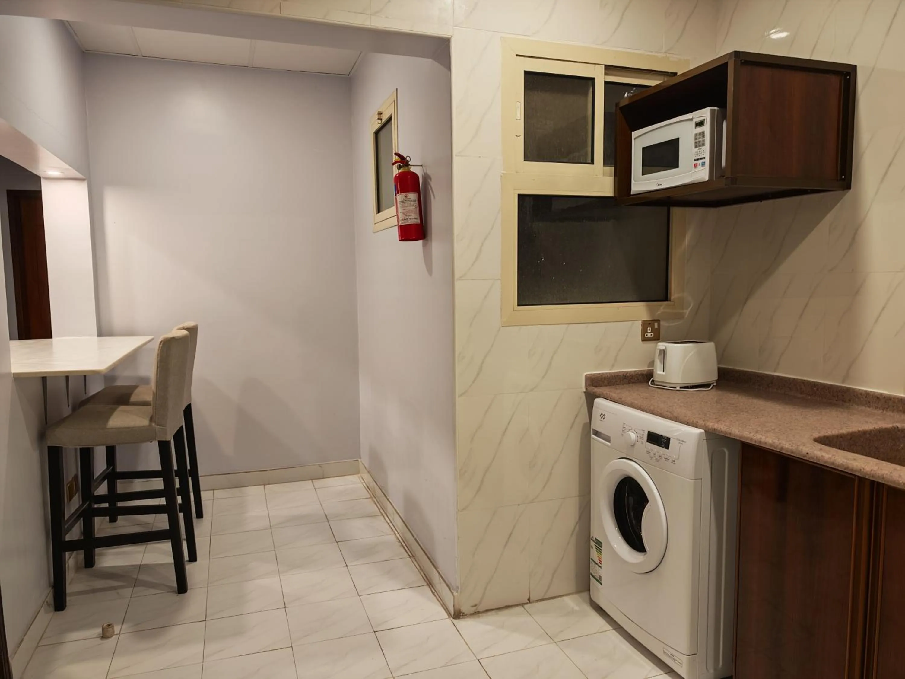 Kitchen or kitchenette in Travellerinn Serviced Apartment