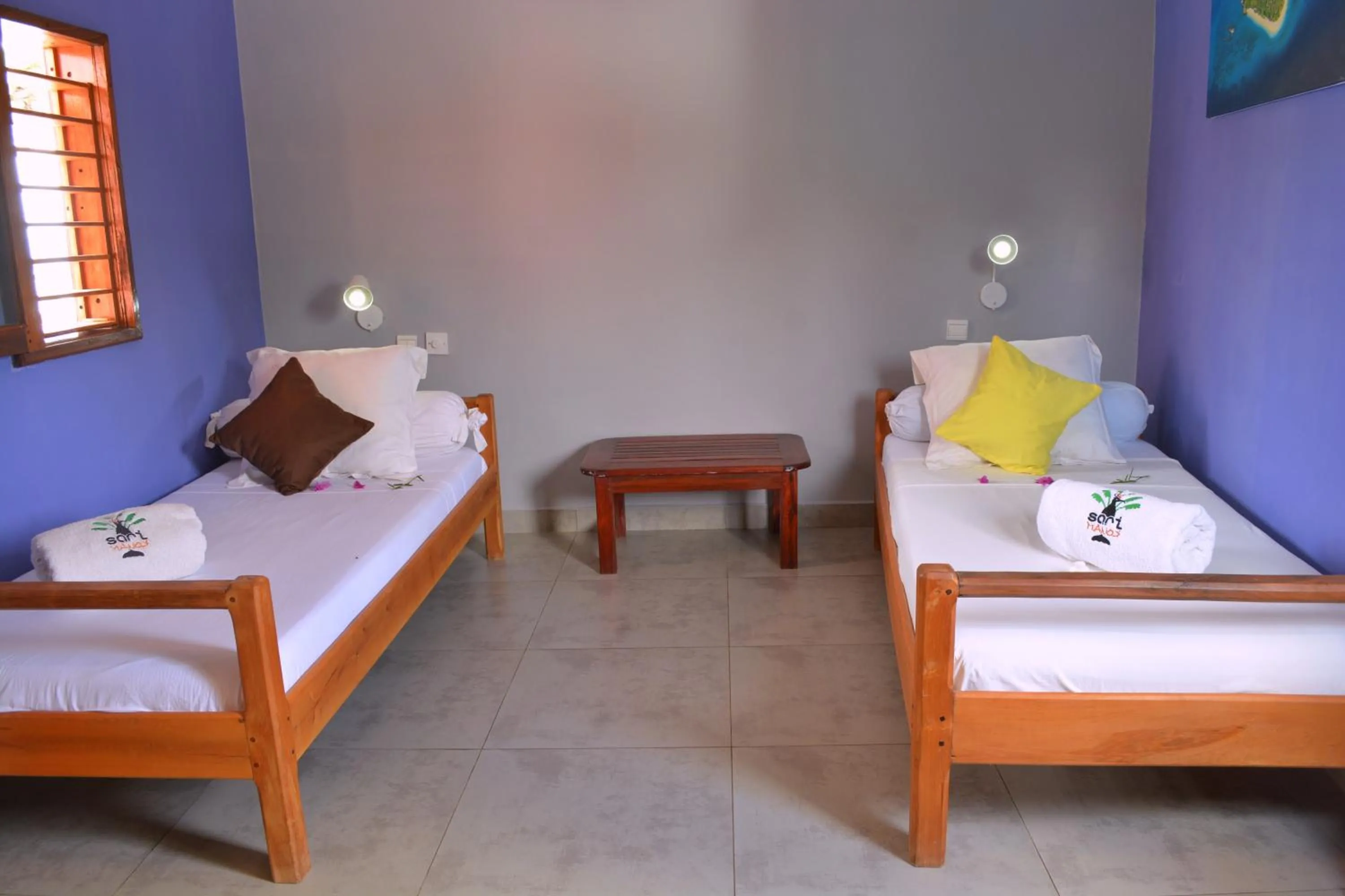 Bed in Hôtel Sarimanok