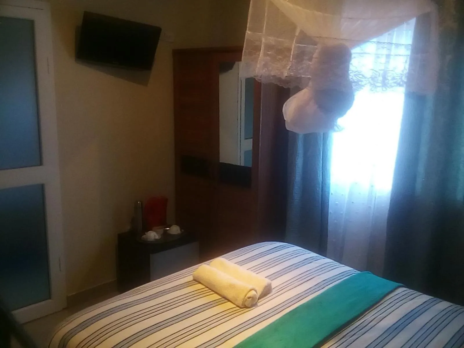 Bed in Royal Olympia Lodges and Safaris Livingstone