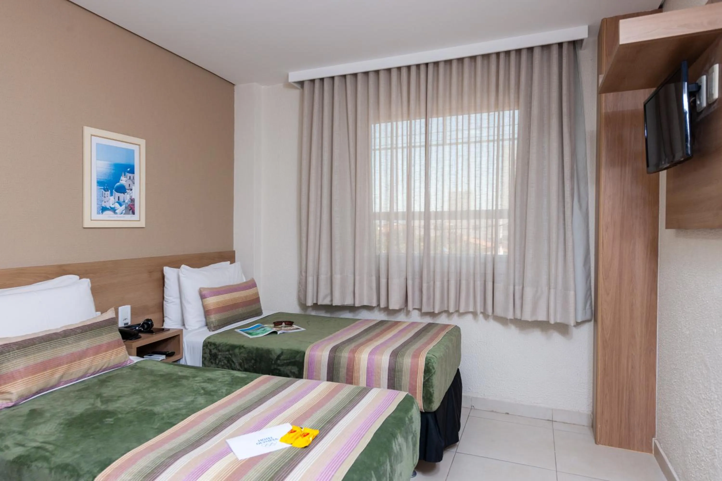 Bed in Hotel Olympia