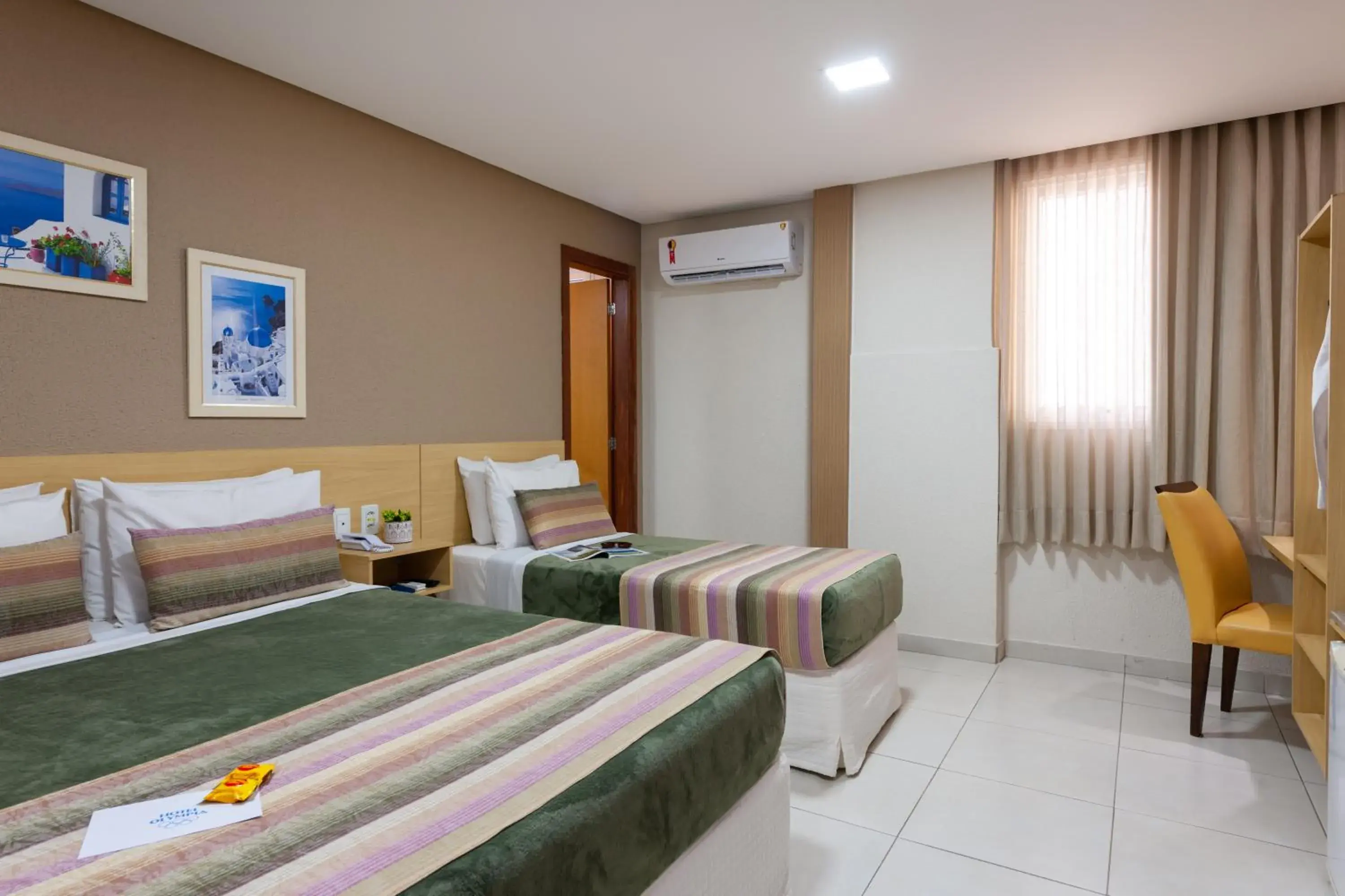 Master Triple Room (1 Double + 1 Single Bed) - single occupancy in Hotel Olympia Master Triple Room (1 Double + 1 Single Bed) - single occupancy in Hotel Olympia