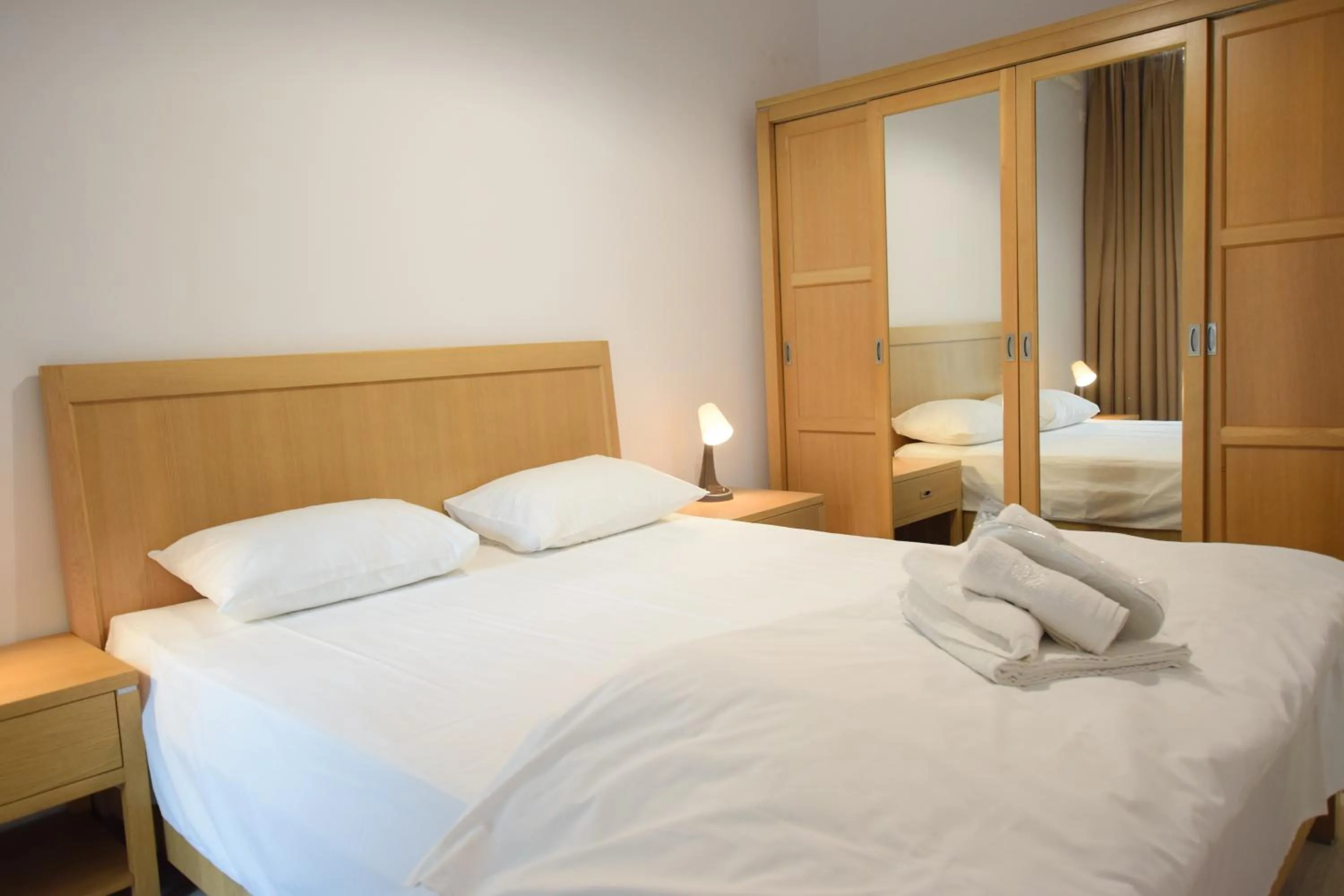 Bed in Uptown Residence Apartments