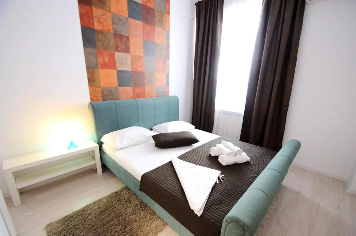 Bed in Uptown Residence Apartments