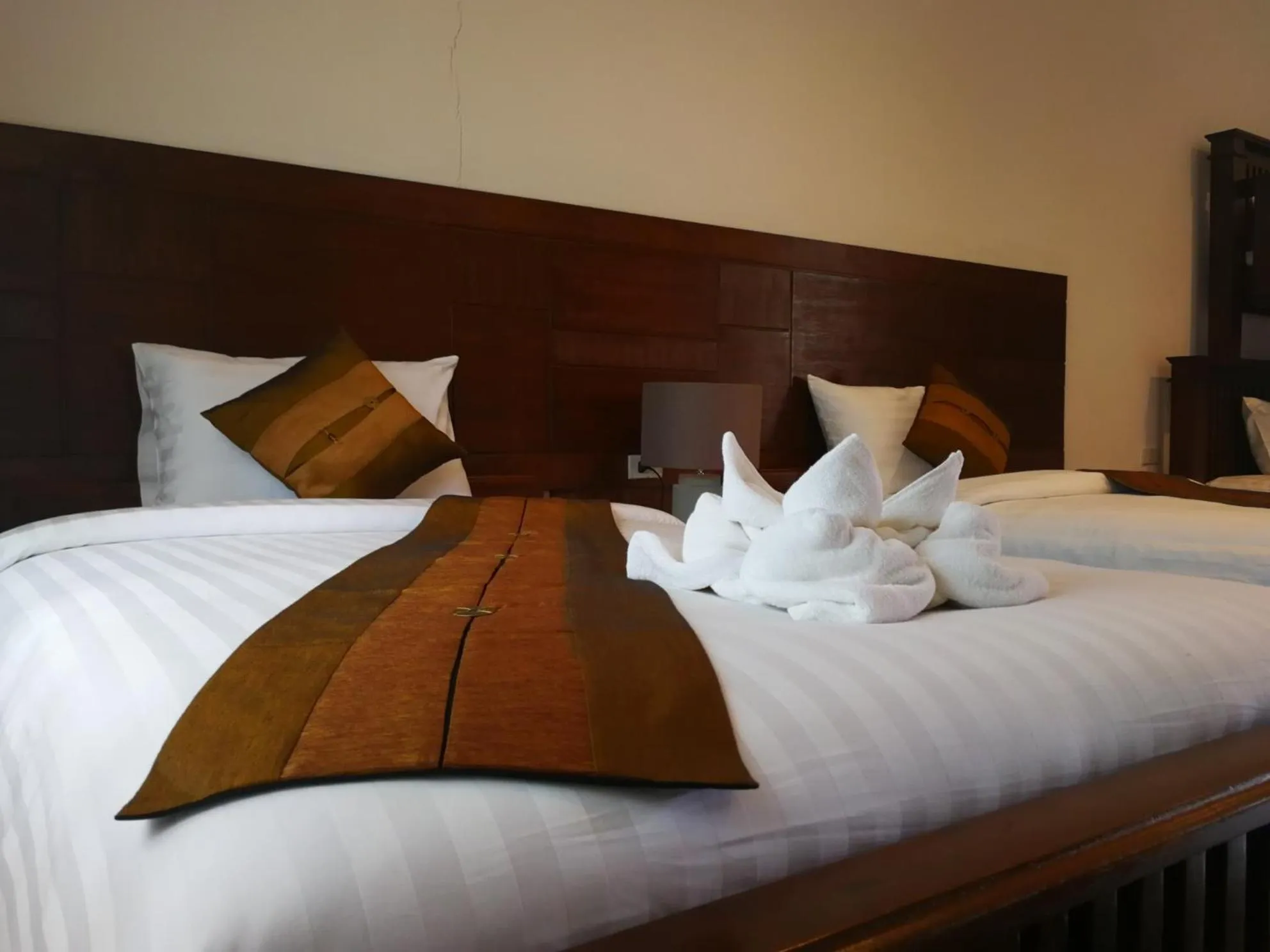 towels, Bed in Buraphat Resort