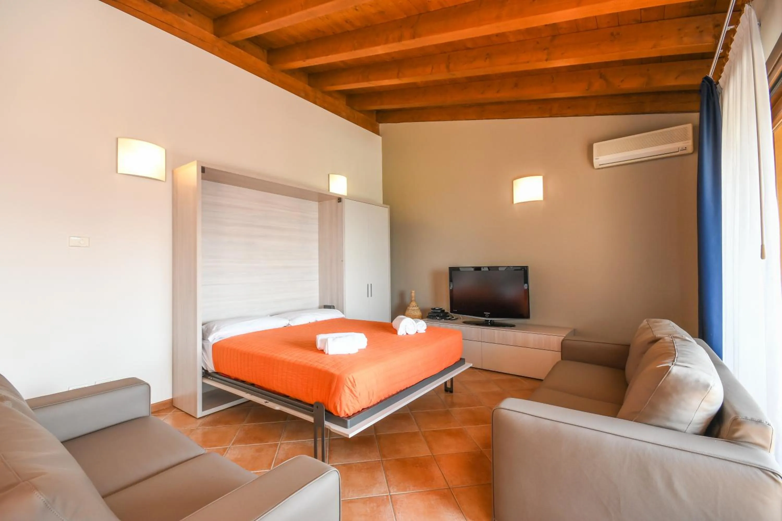 Living room, Bed in Residence Corte Ferrari -Ciao Vacanze-