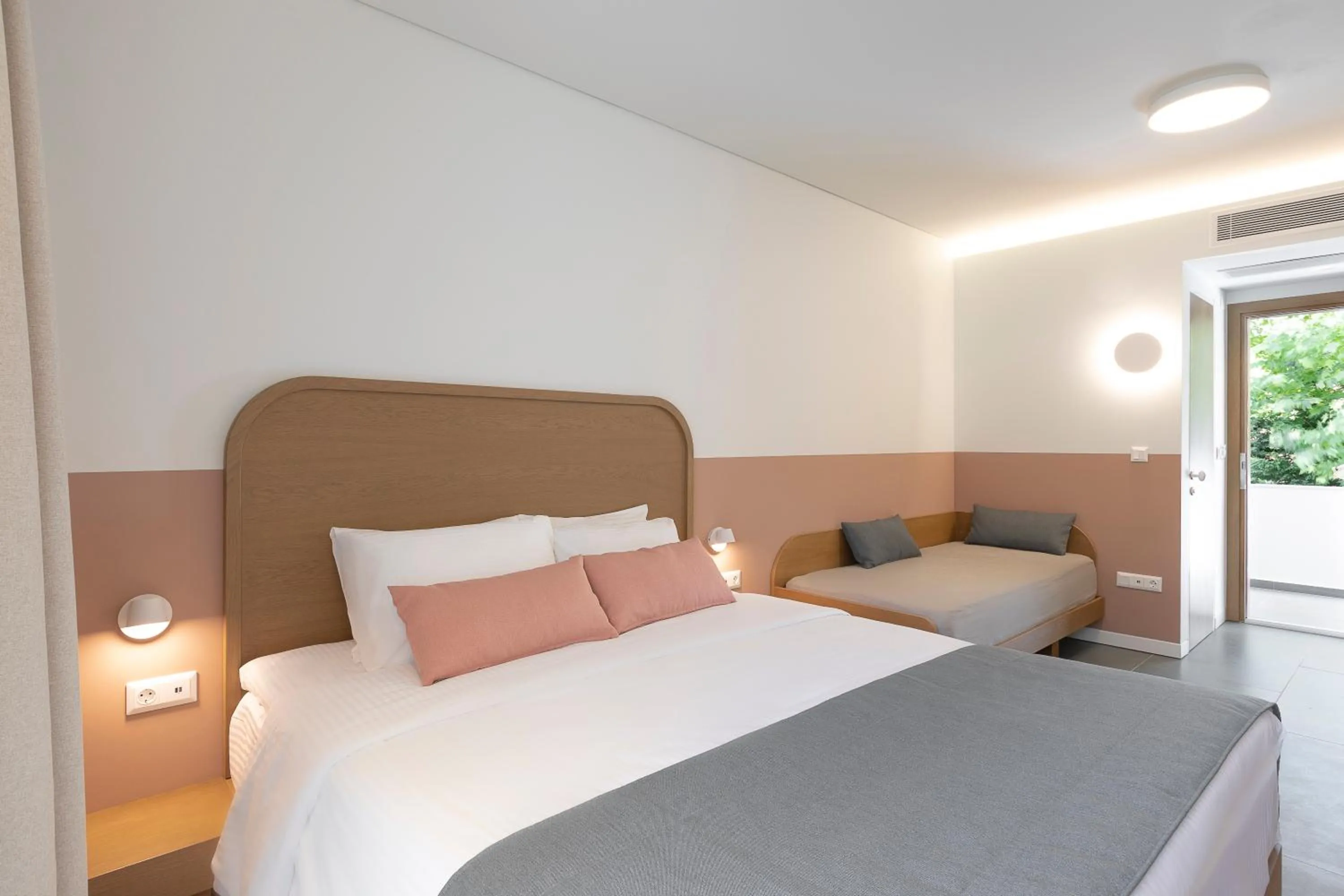 Bed in Mandraki Village Boutique Hotel