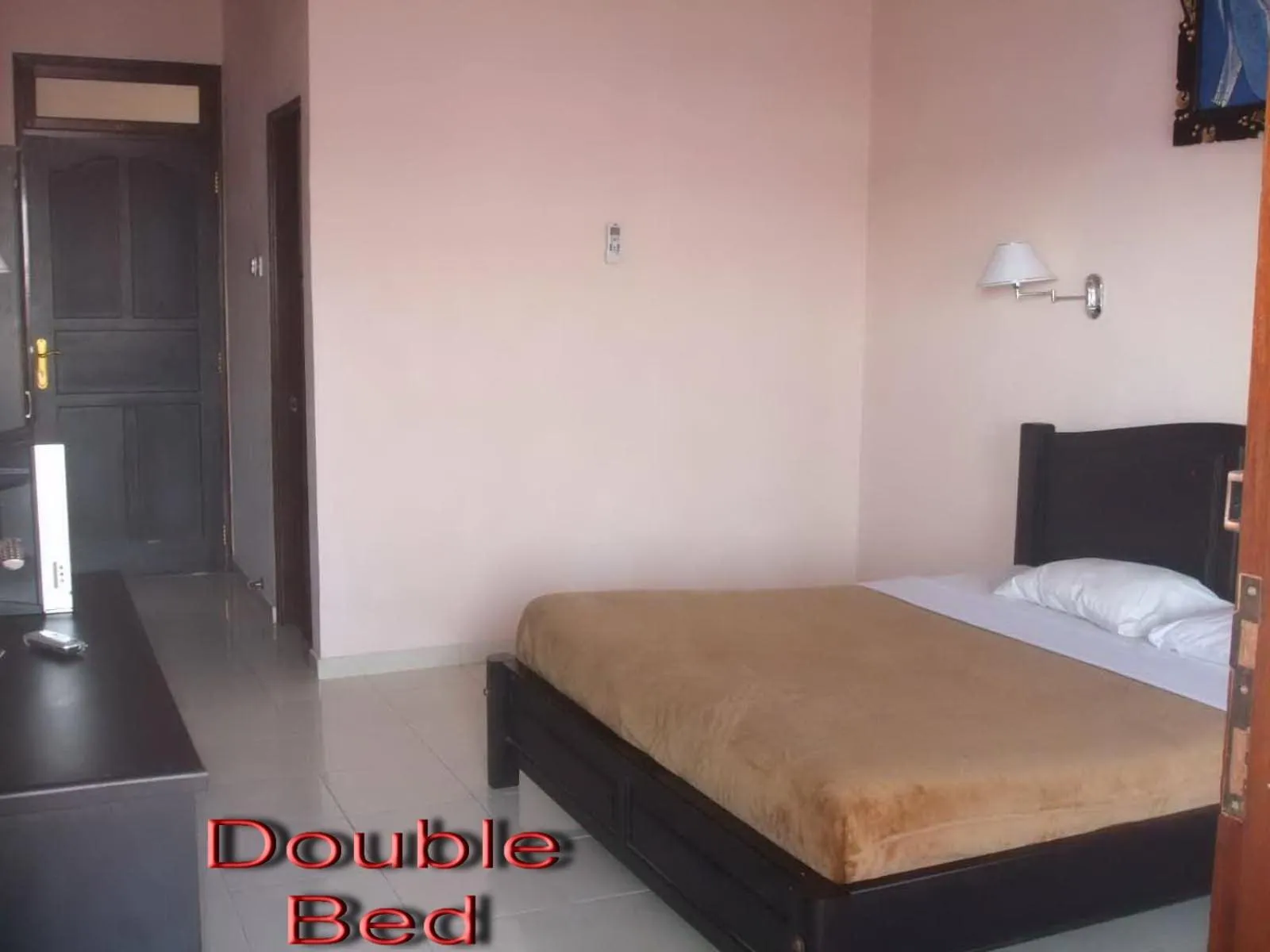 Bed in Pesona Beach Inn