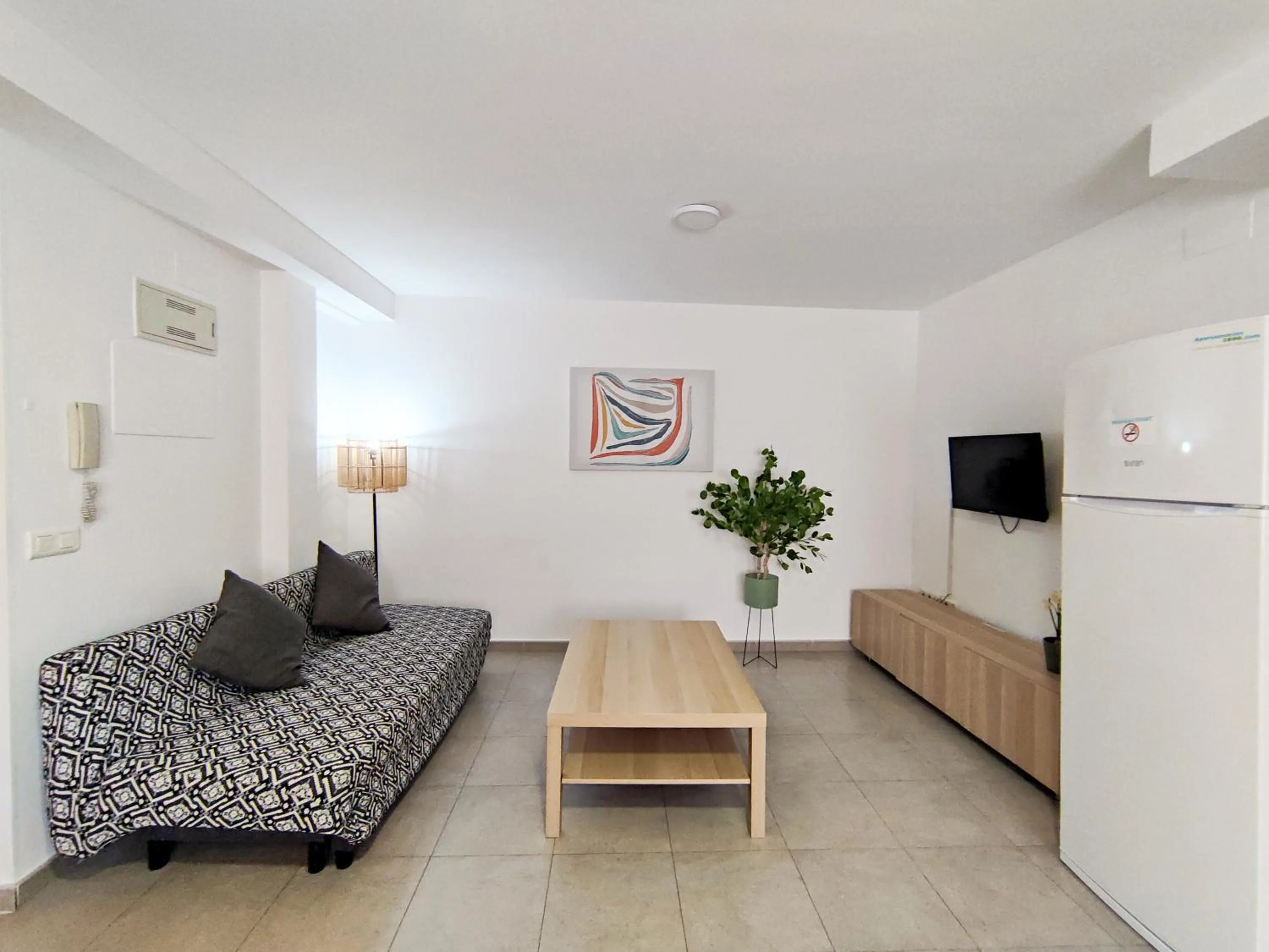 Living room, Bed in Apartamentos Gandía Centro 3000