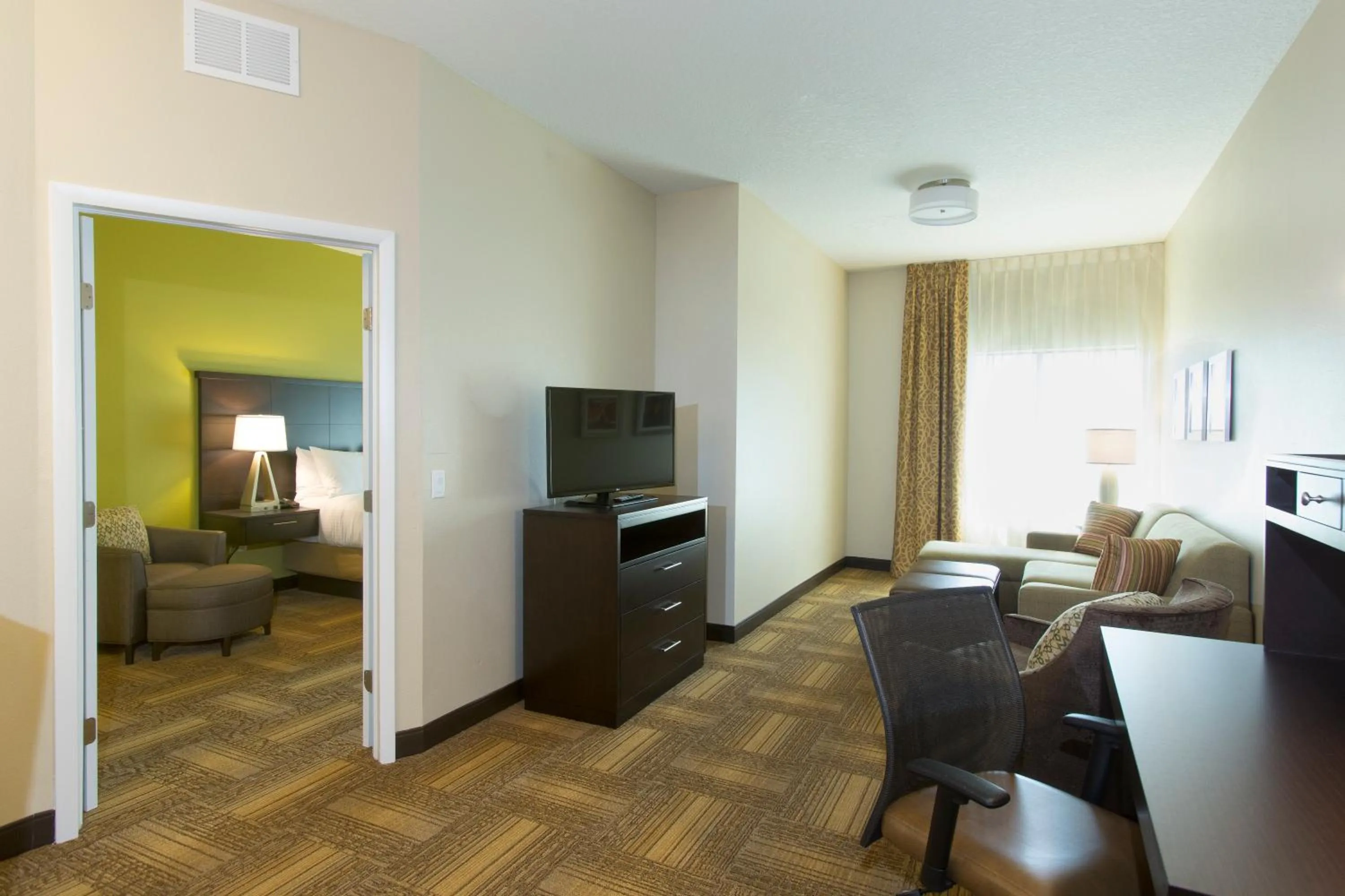 Photo of the whole room in Staybridge Suites Orlando at SeaWorld by IHG - Free Breakfast & Shuttle to SeaWorld Parks