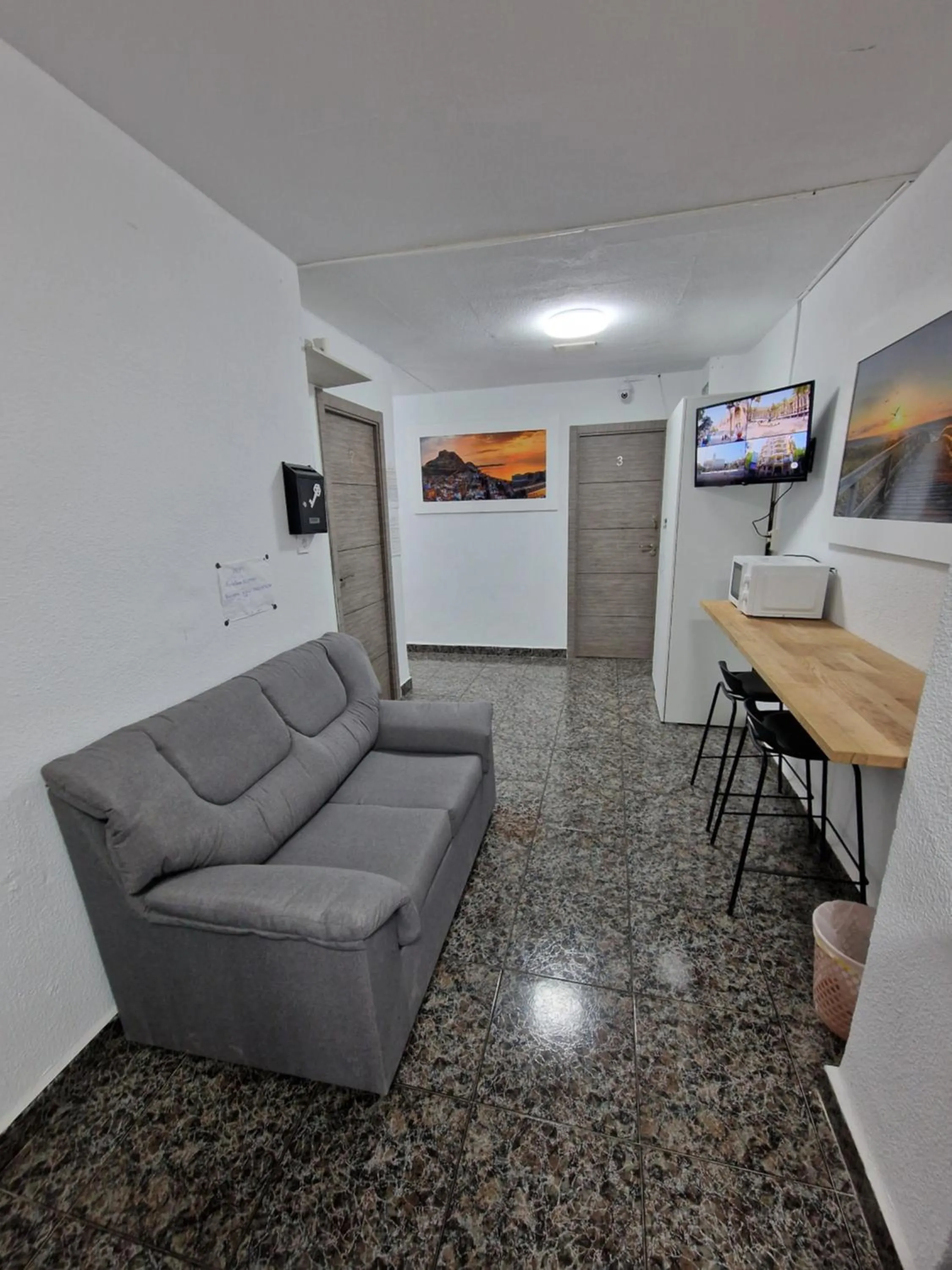Communal lounge/ TV room in Old Center Inn Alicante