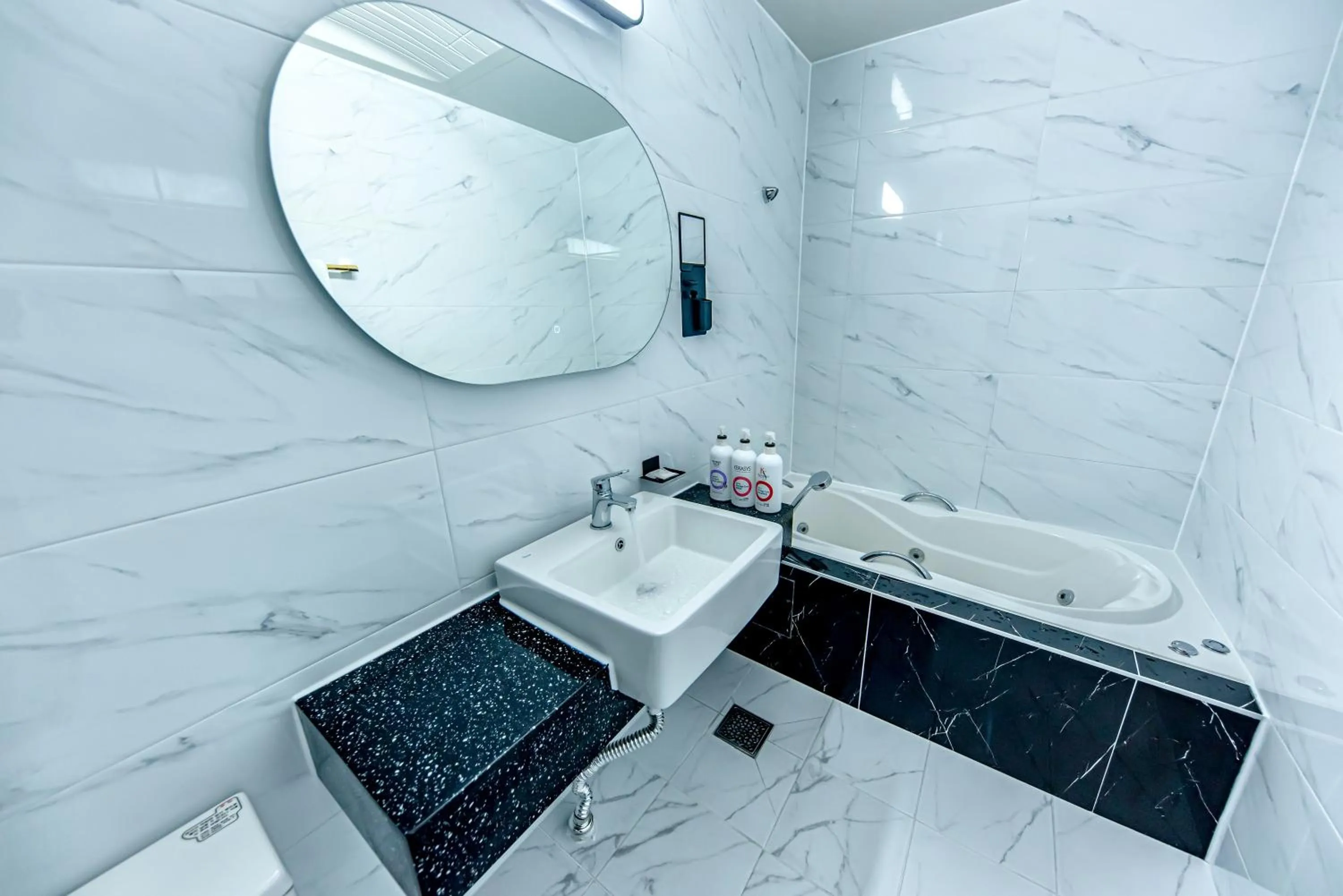 Bathroom in HS Tourist Hotel