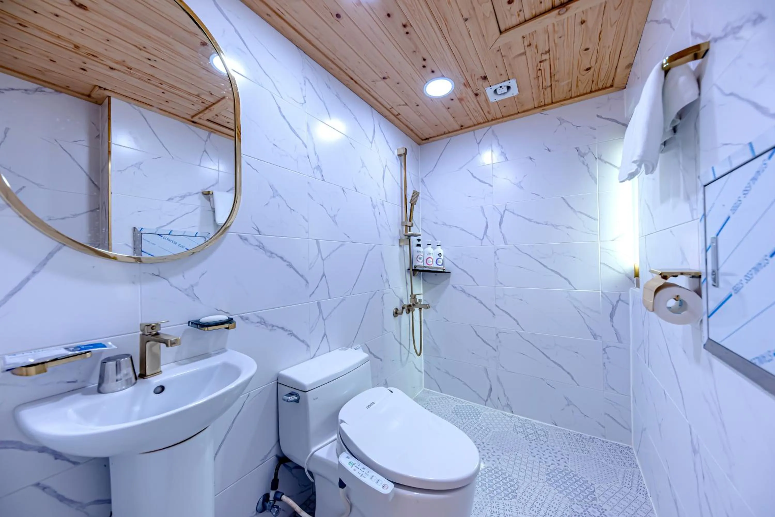 Bathroom in HS Tourist Hotel