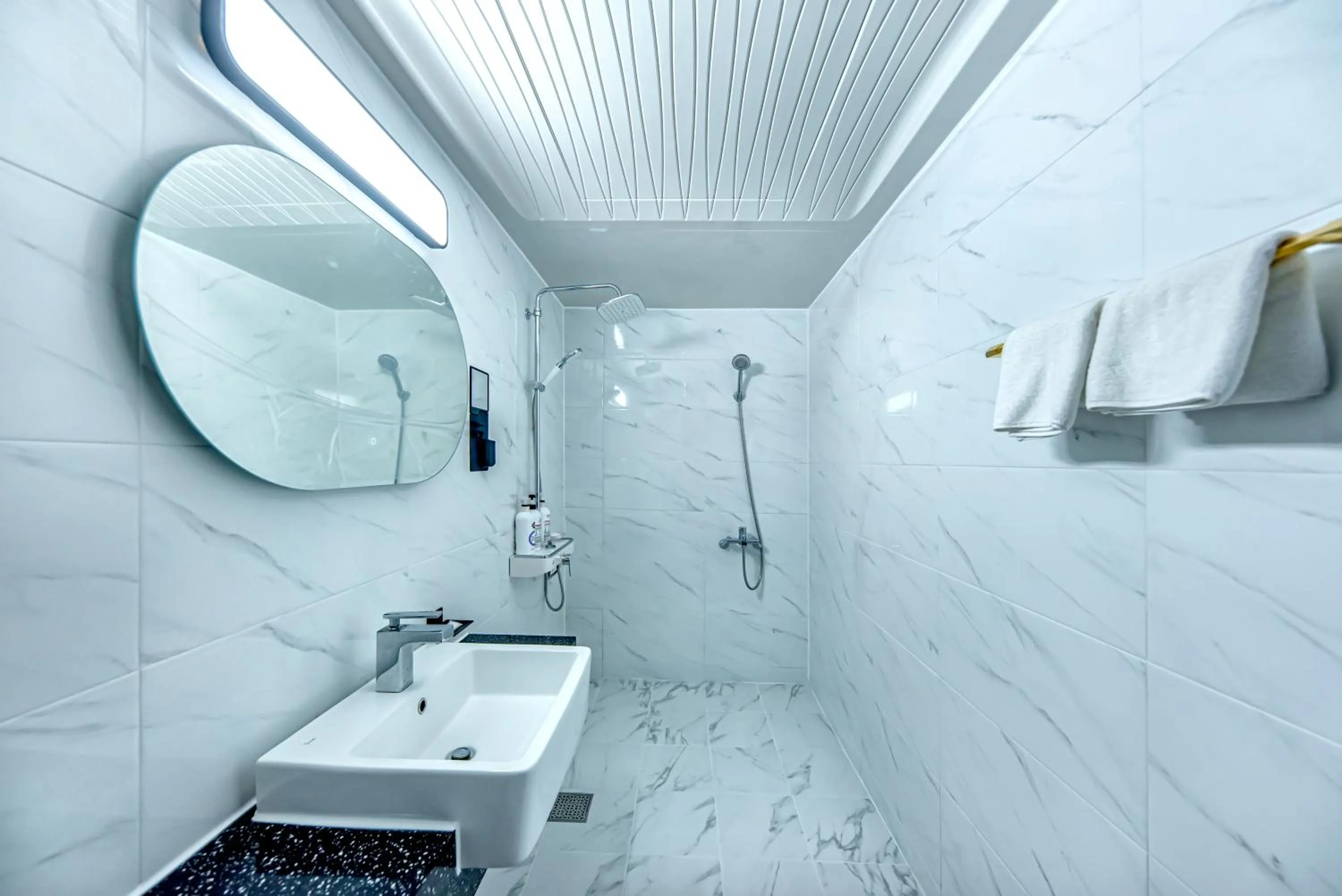 Bathroom in HS Tourist Hotel