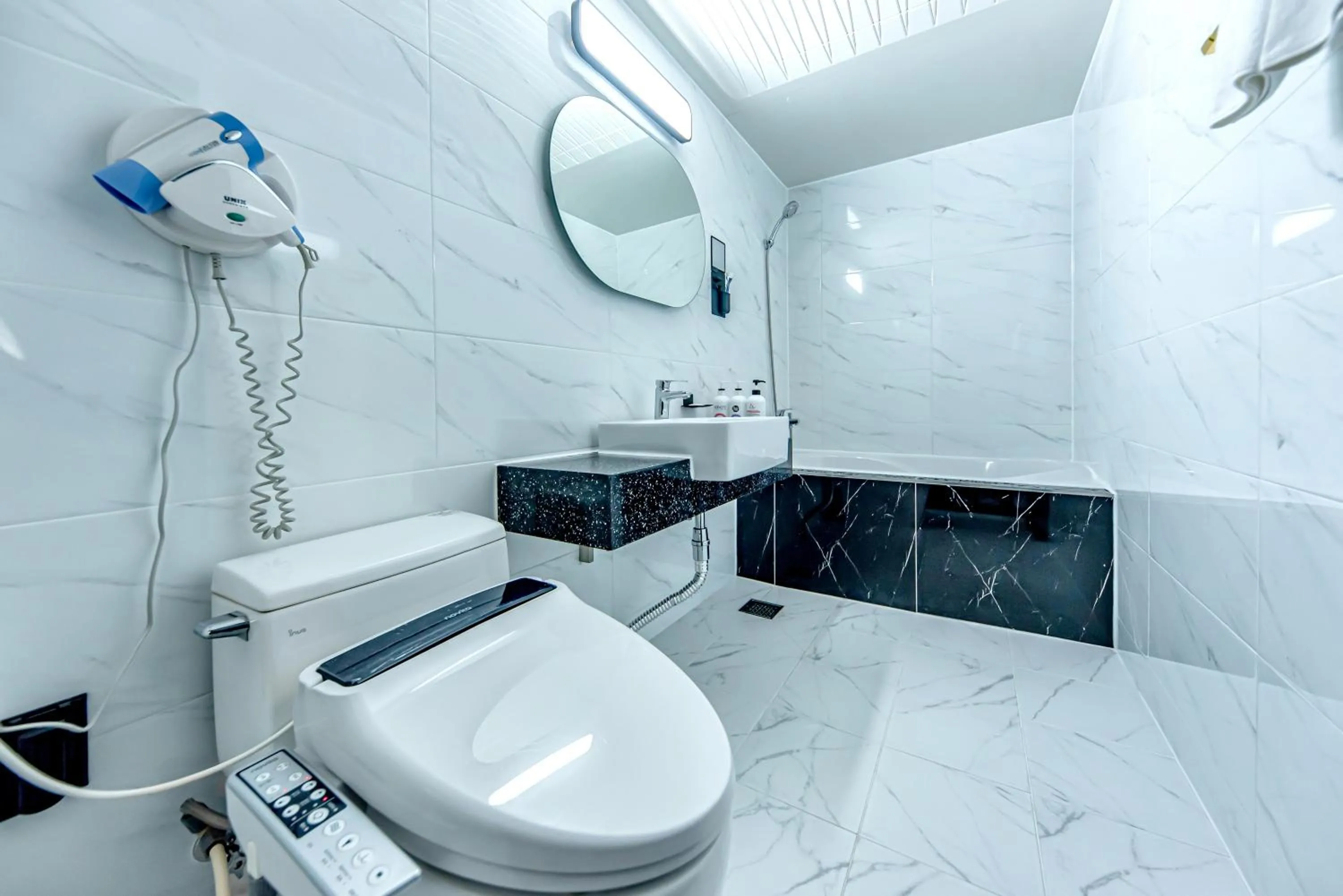 Bathroom in HS Tourist Hotel