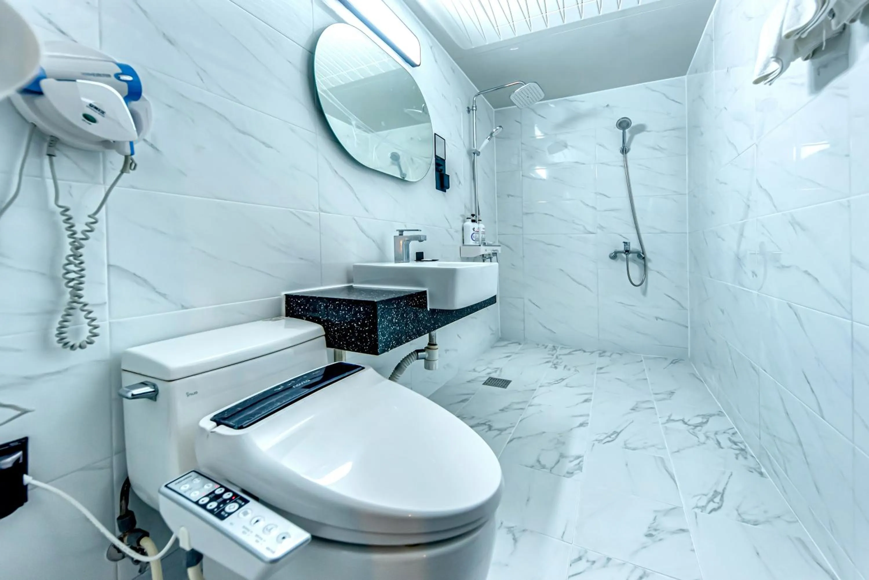 Bathroom in HS Tourist Hotel