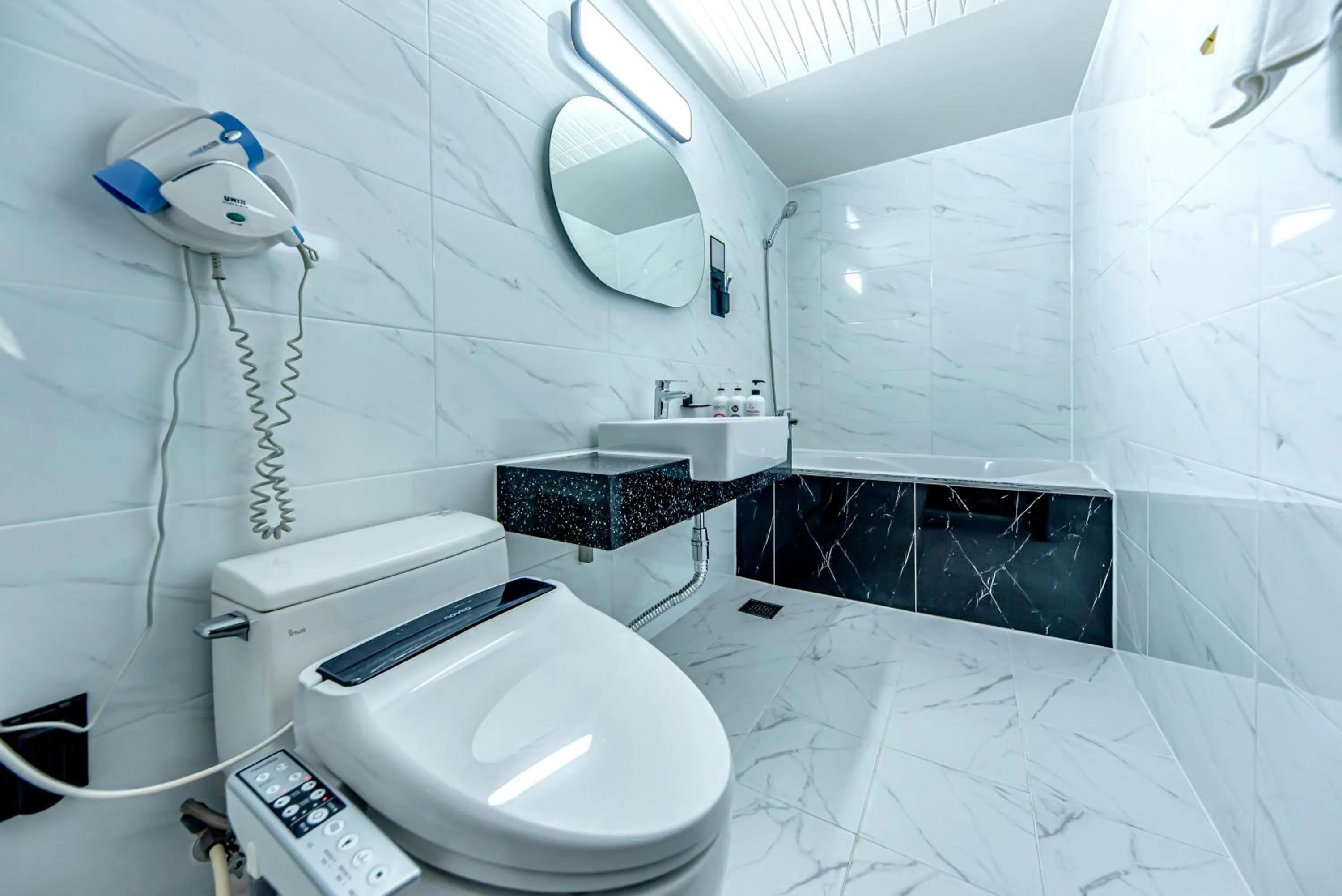 Bathroom in HS Tourist Hotel