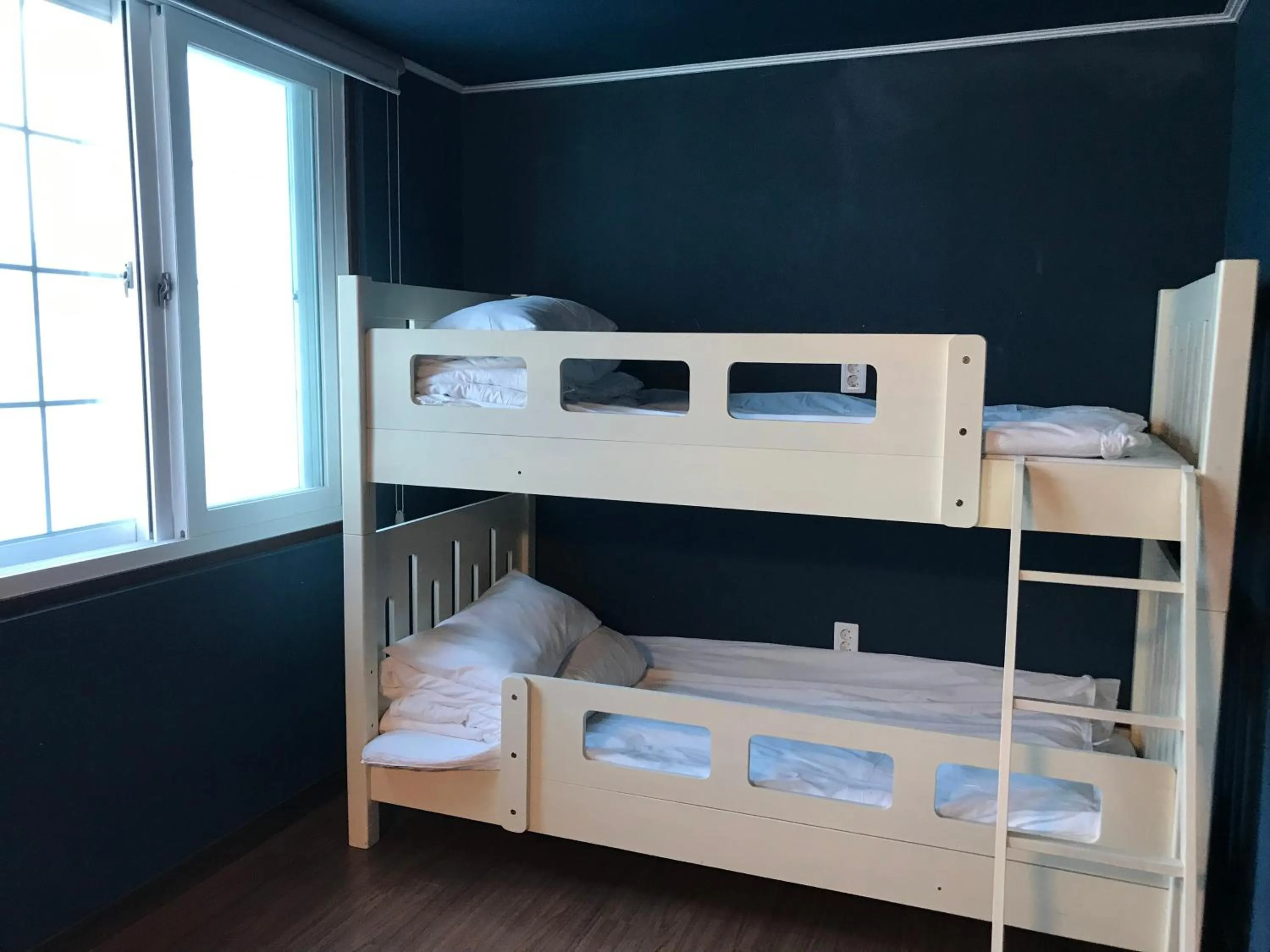 Bed in Grim Garden Guesthouse