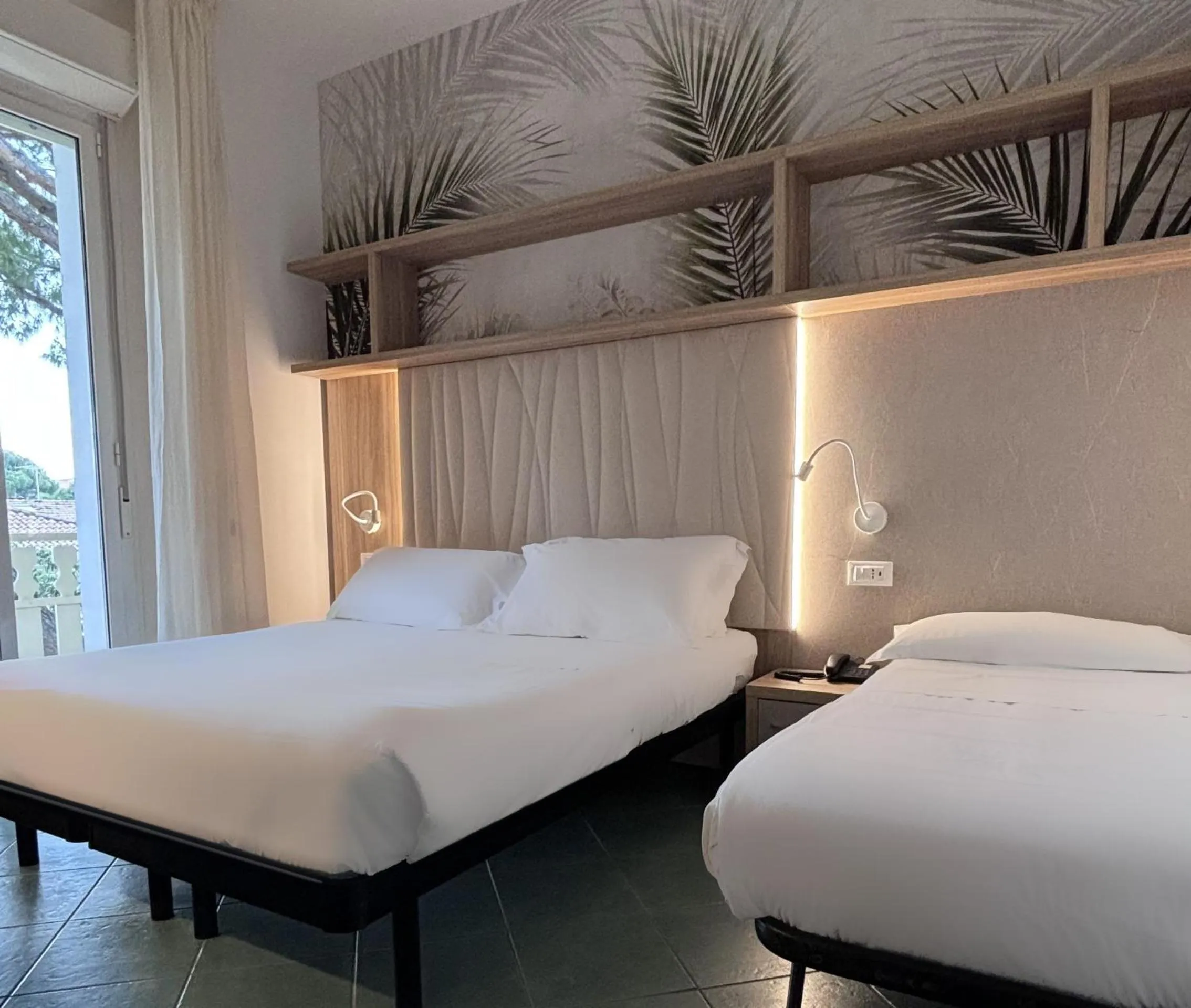 Bed in Pinetina Mare Baby Family Hotel