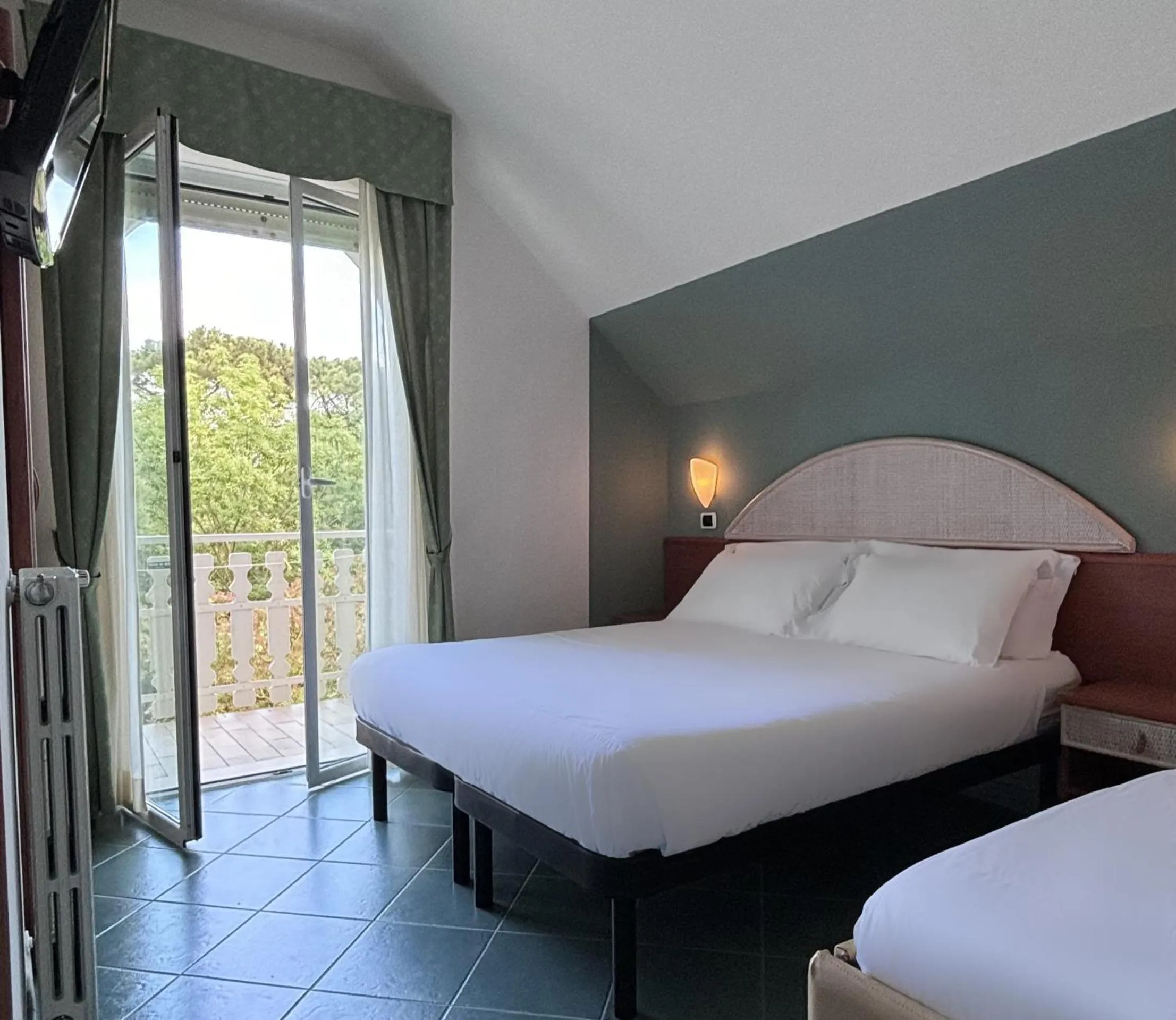 Bed in Pinetina Mare Baby Family Hotel