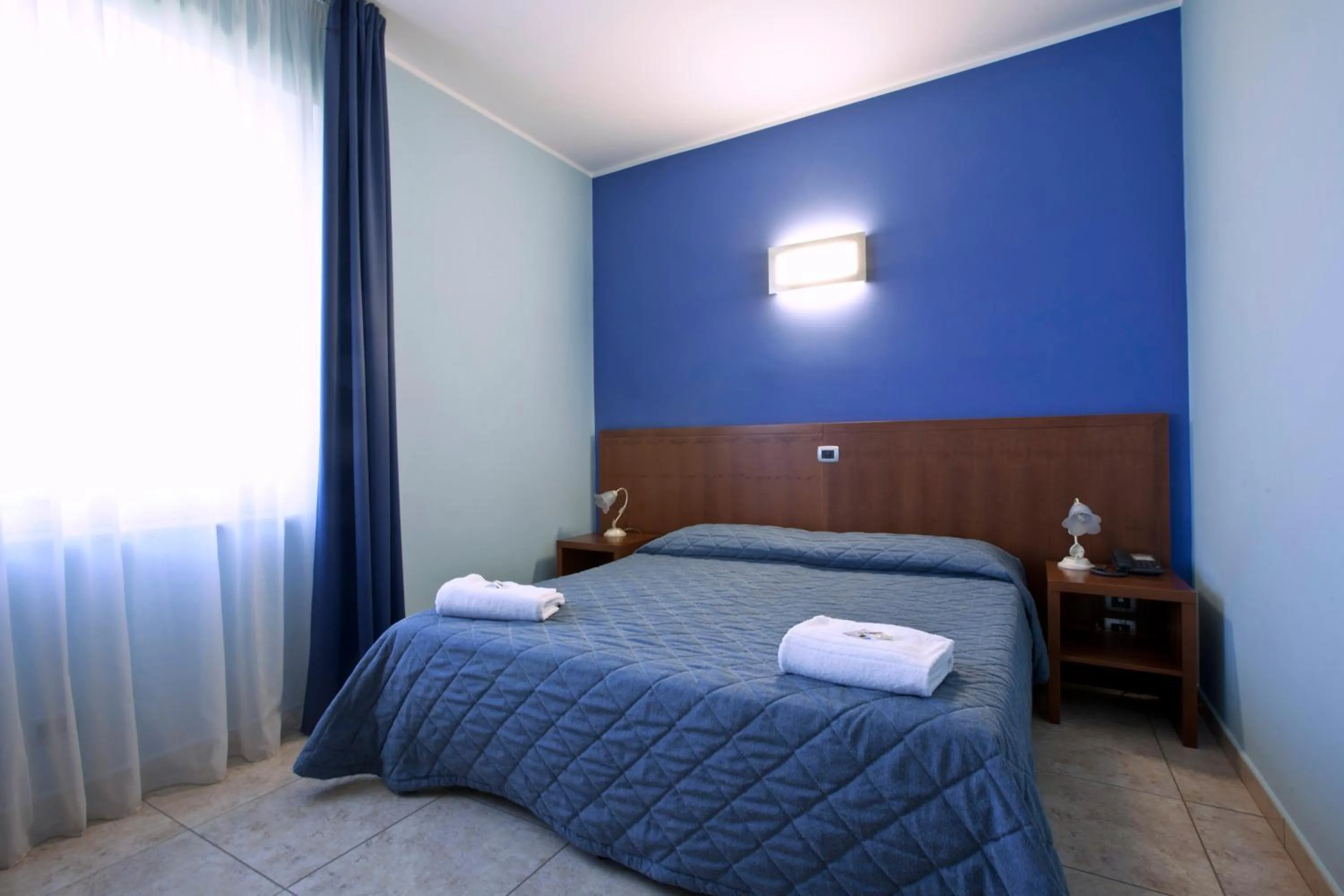 Bedroom in Hotel San Martino