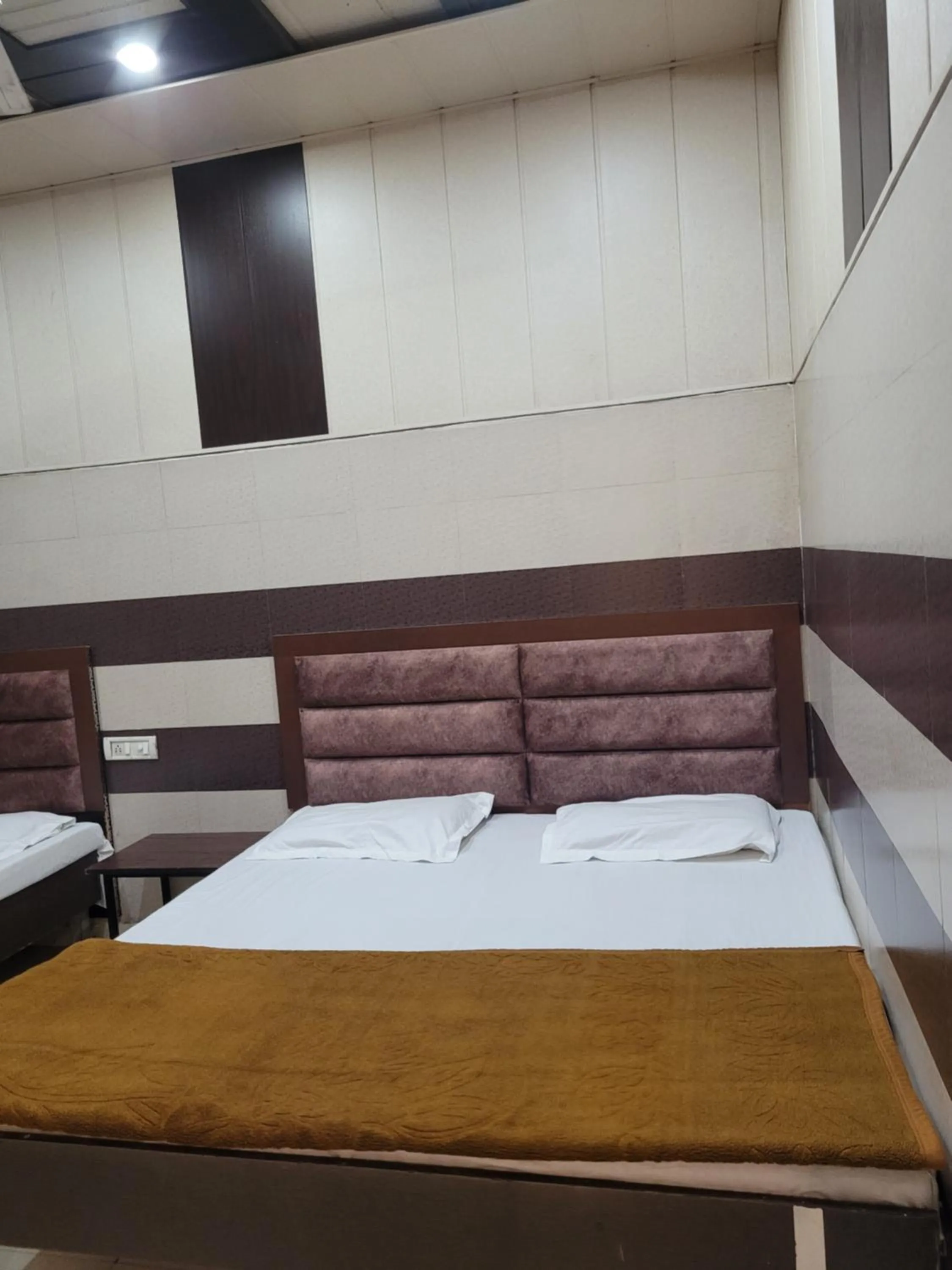 Bed in Asha Guest House