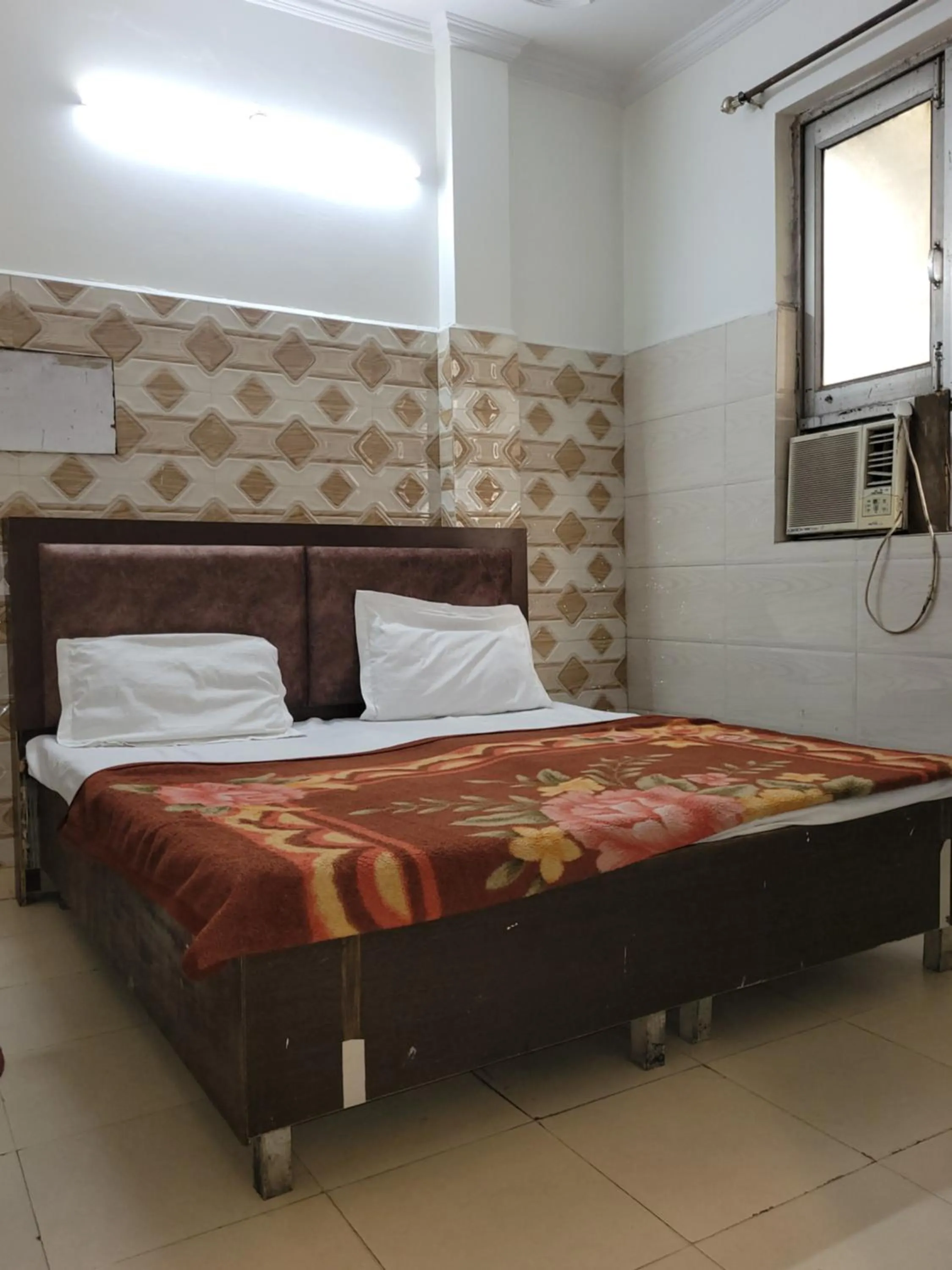 Bed in Asha Guest House