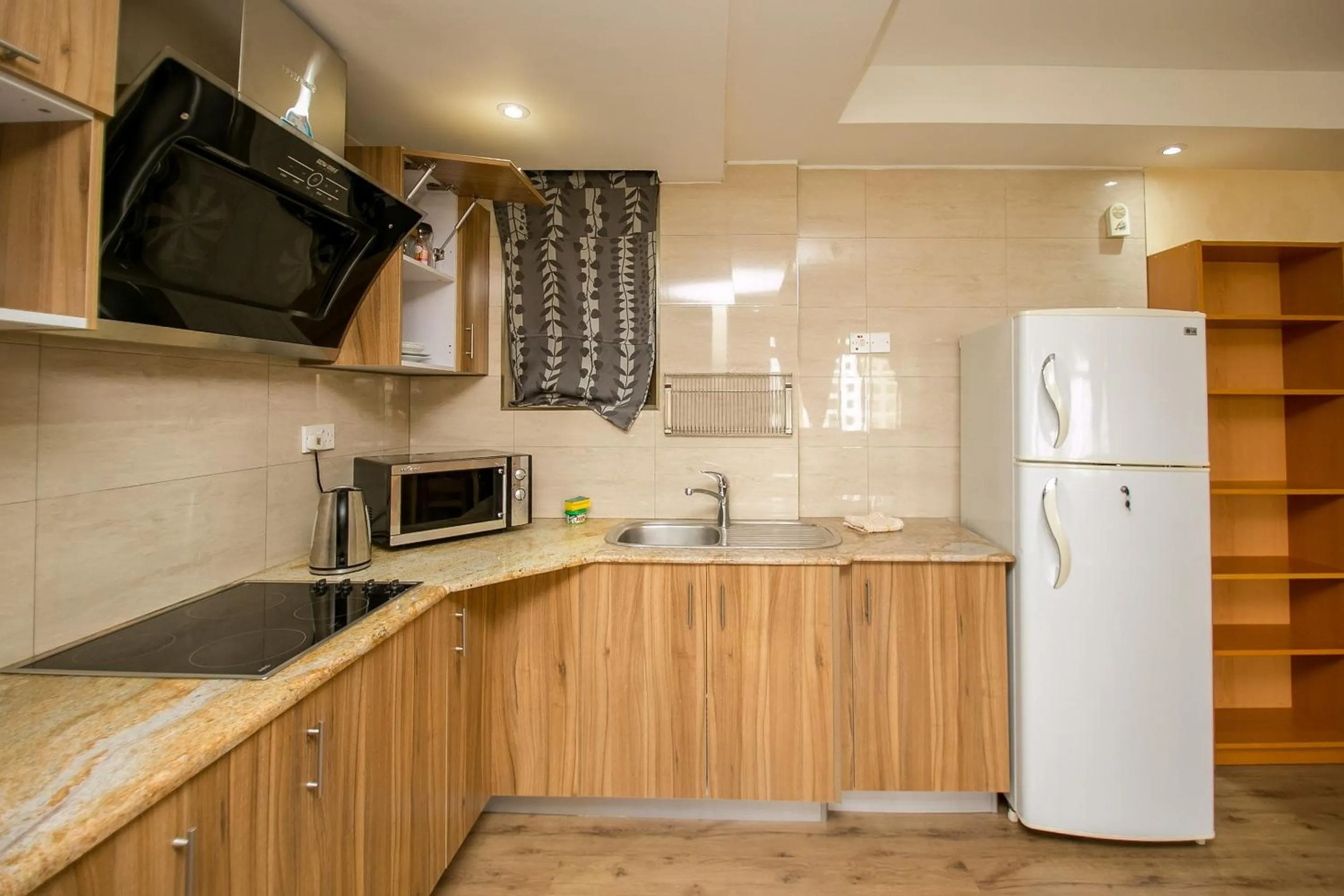 Kitchen or kitchenette in Kates Apartments