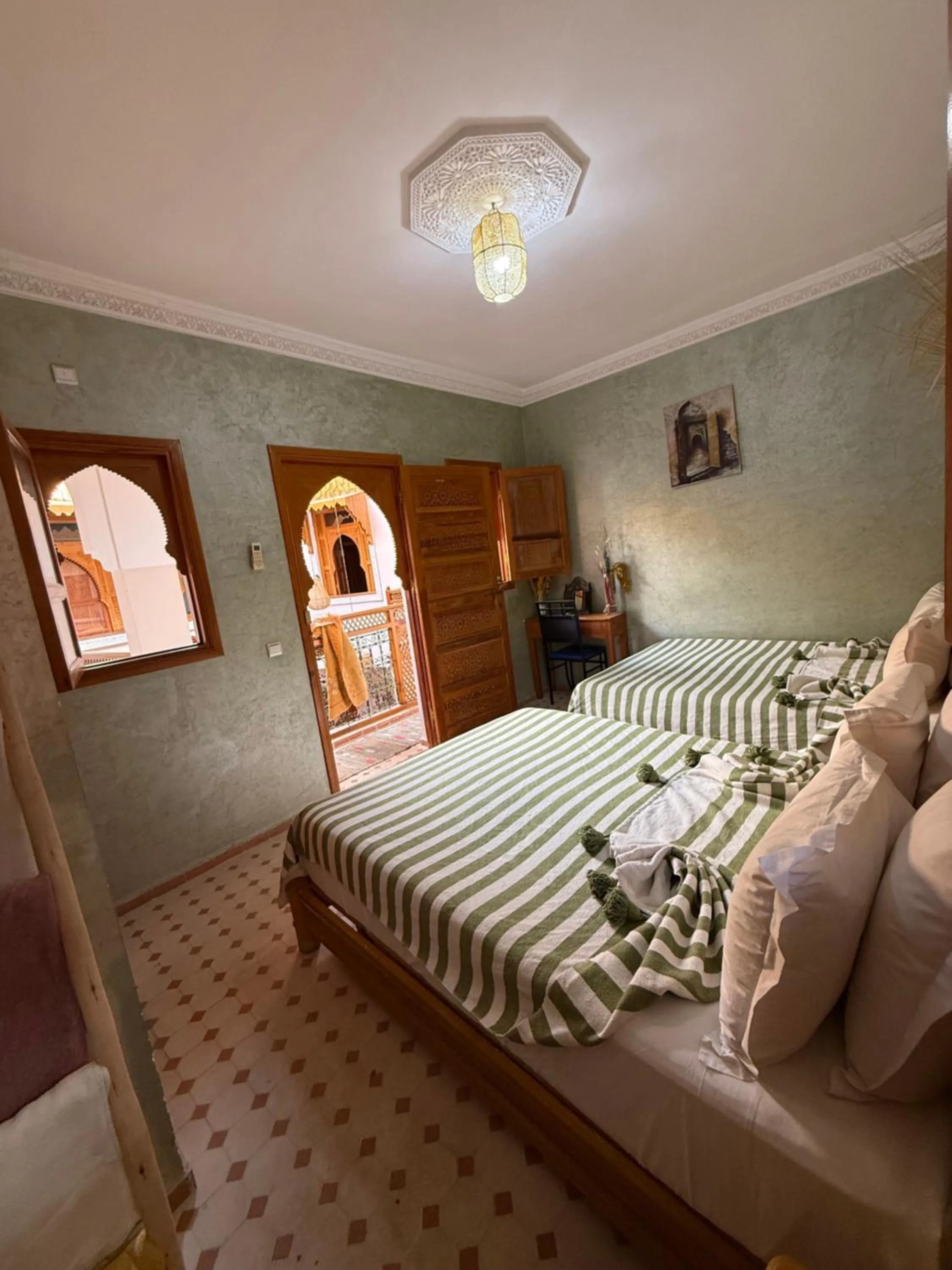 Seating area, Bed in Riad Jenan Adam