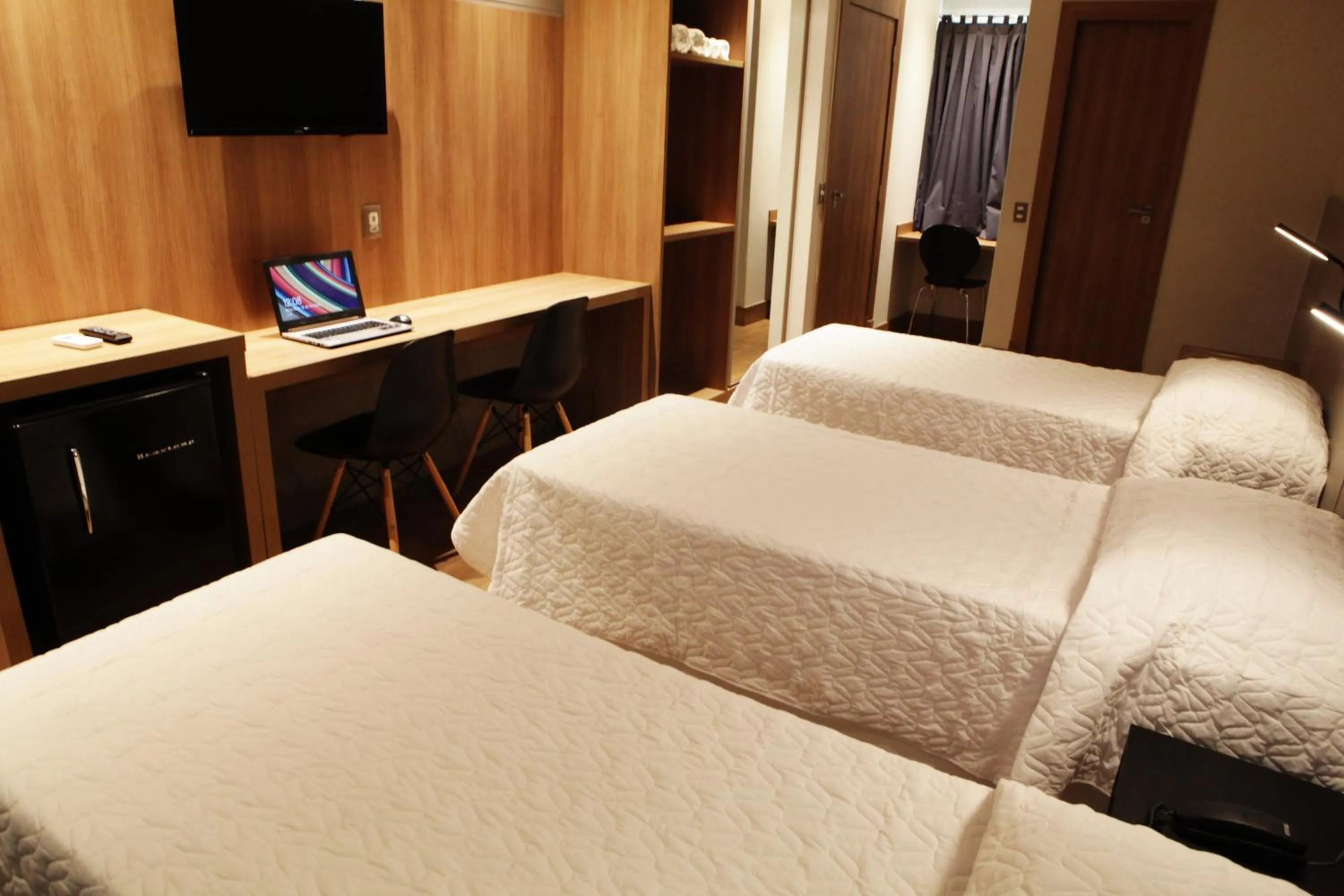 Communal lounge/ TV room, Bed in Plaza Spania Boutique Hotel