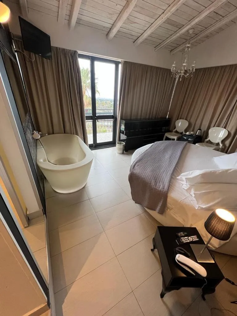 Bed in Michelangelo Etna Hotel