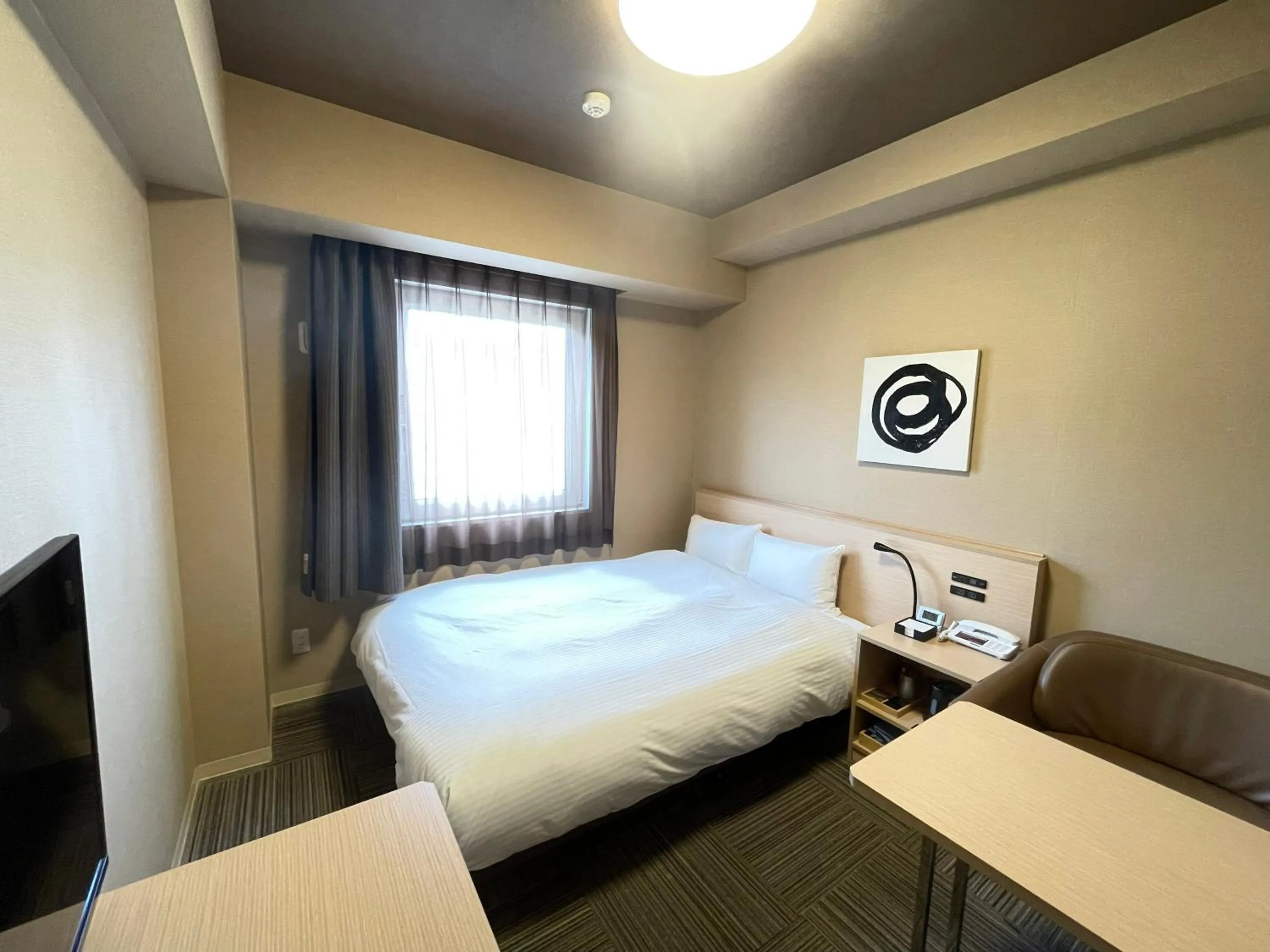Photo of the whole room, Bed in Hotel Route Inn Grand Ueda Ekimae