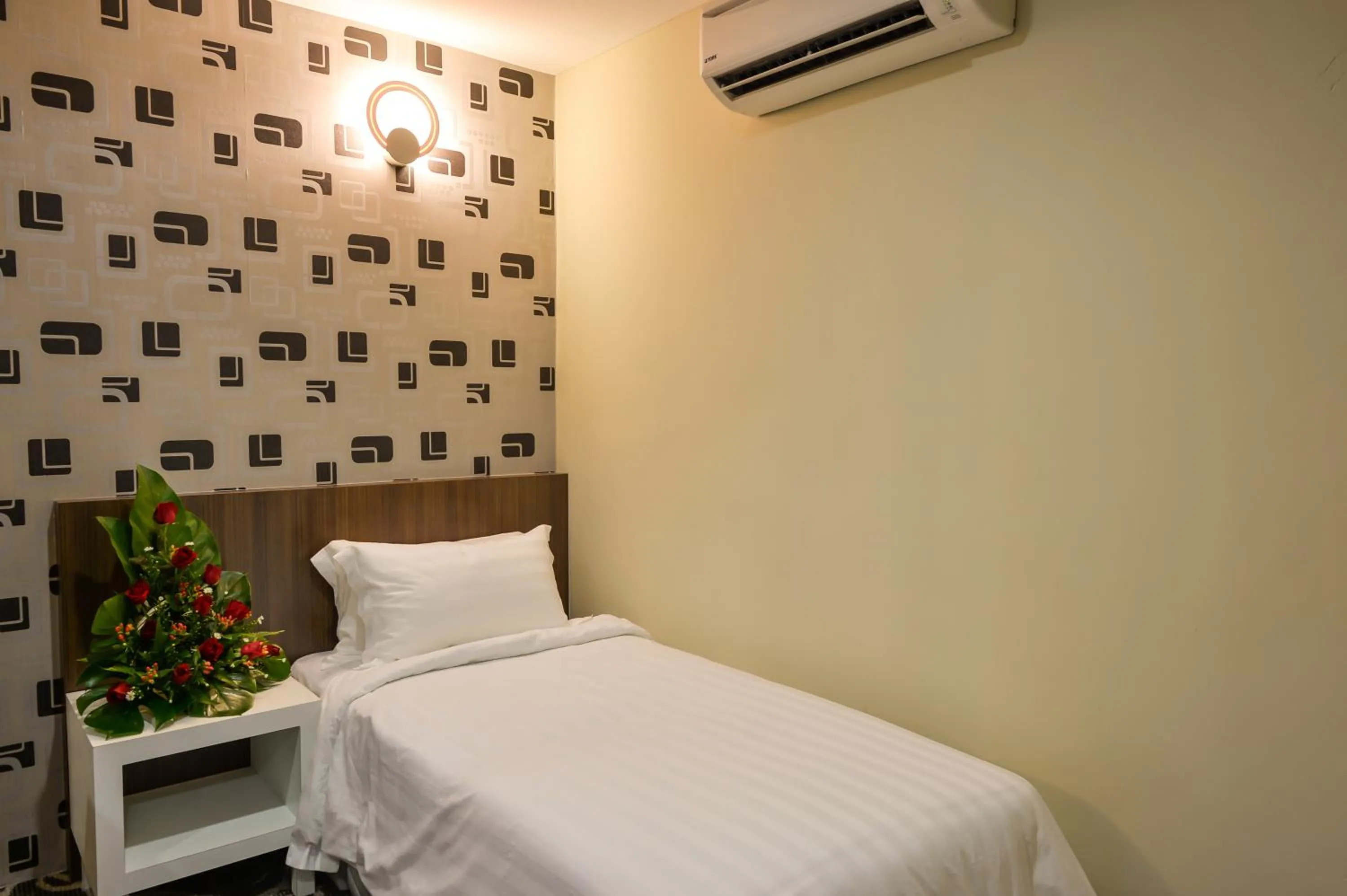 Bed in De Champs Hotel