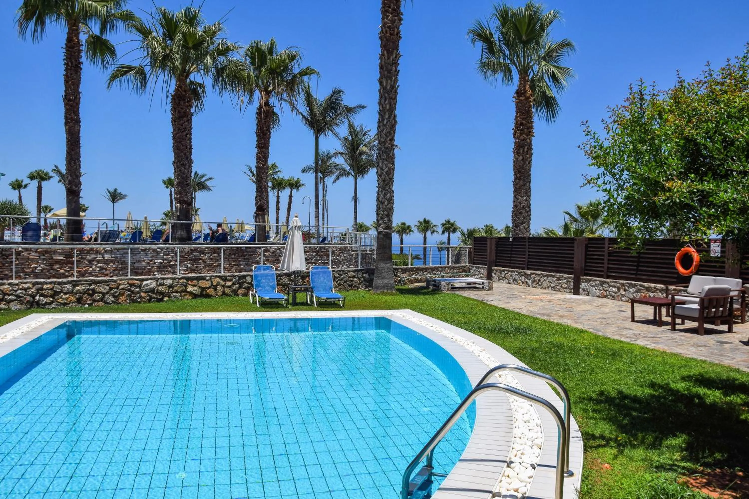 Patio, Swimming Pool in Royal Heights Resort Villas & Spa