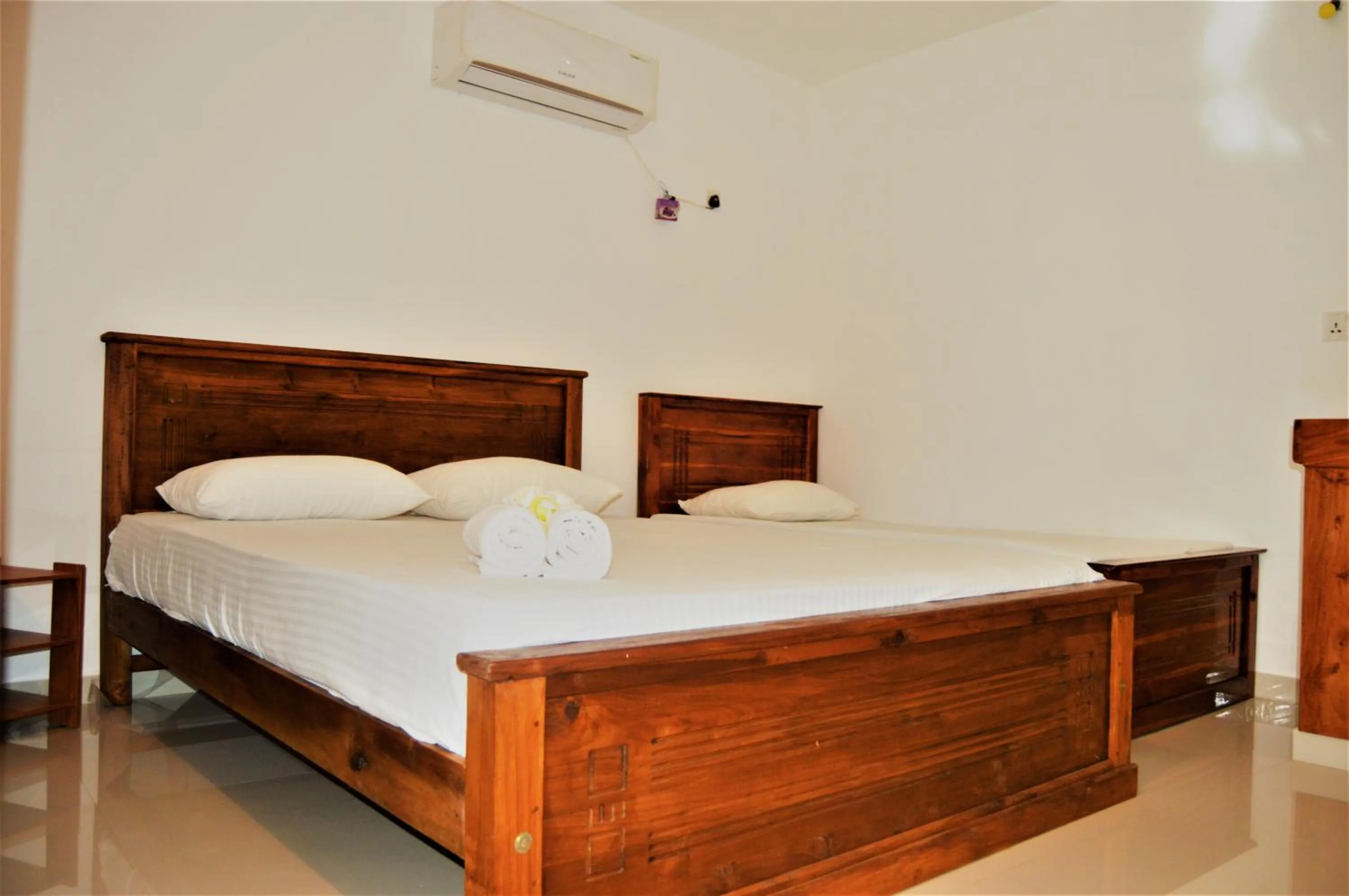 Bed in Shim Beach Resort