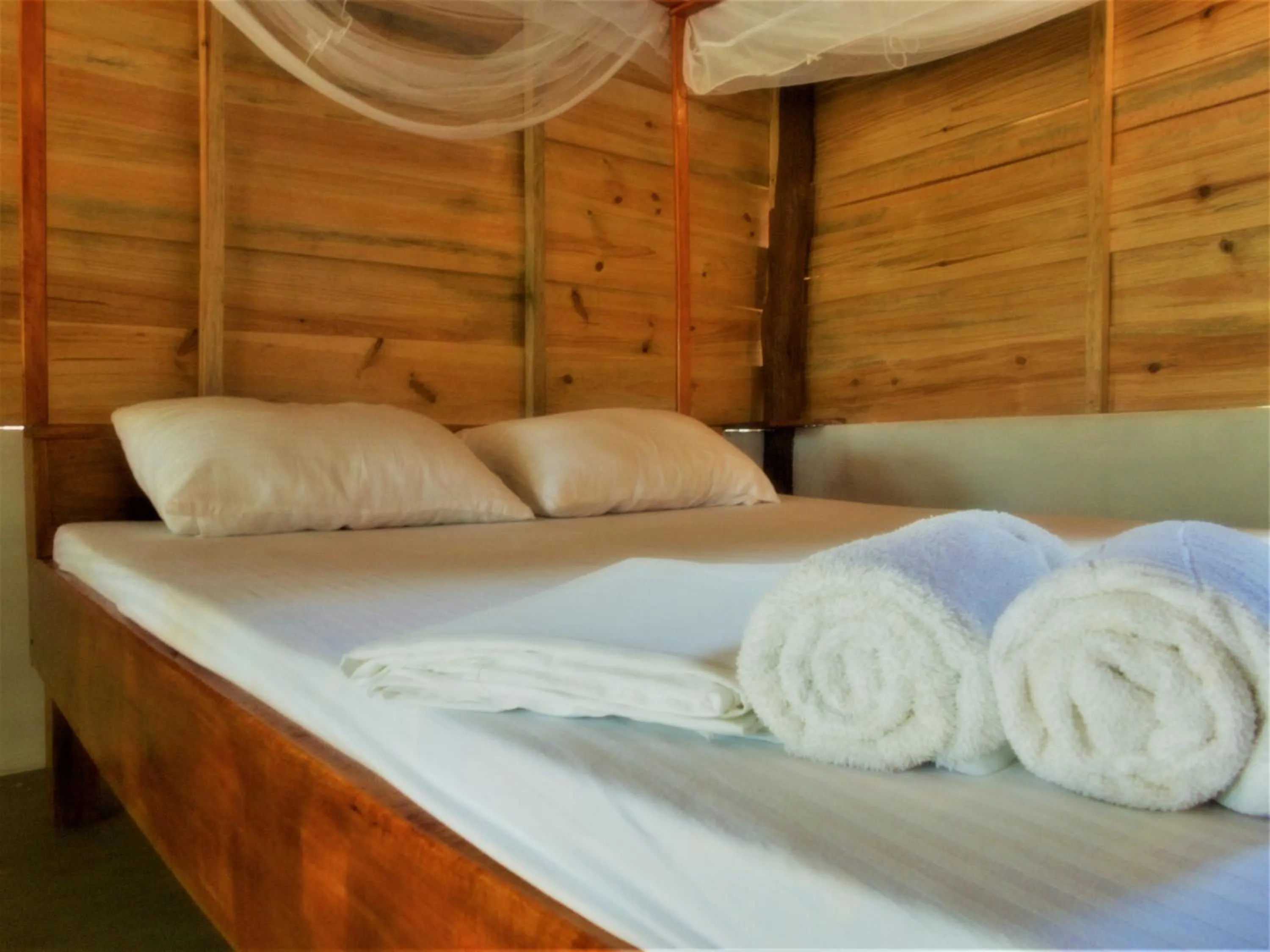 Bed in Shim Beach Resort